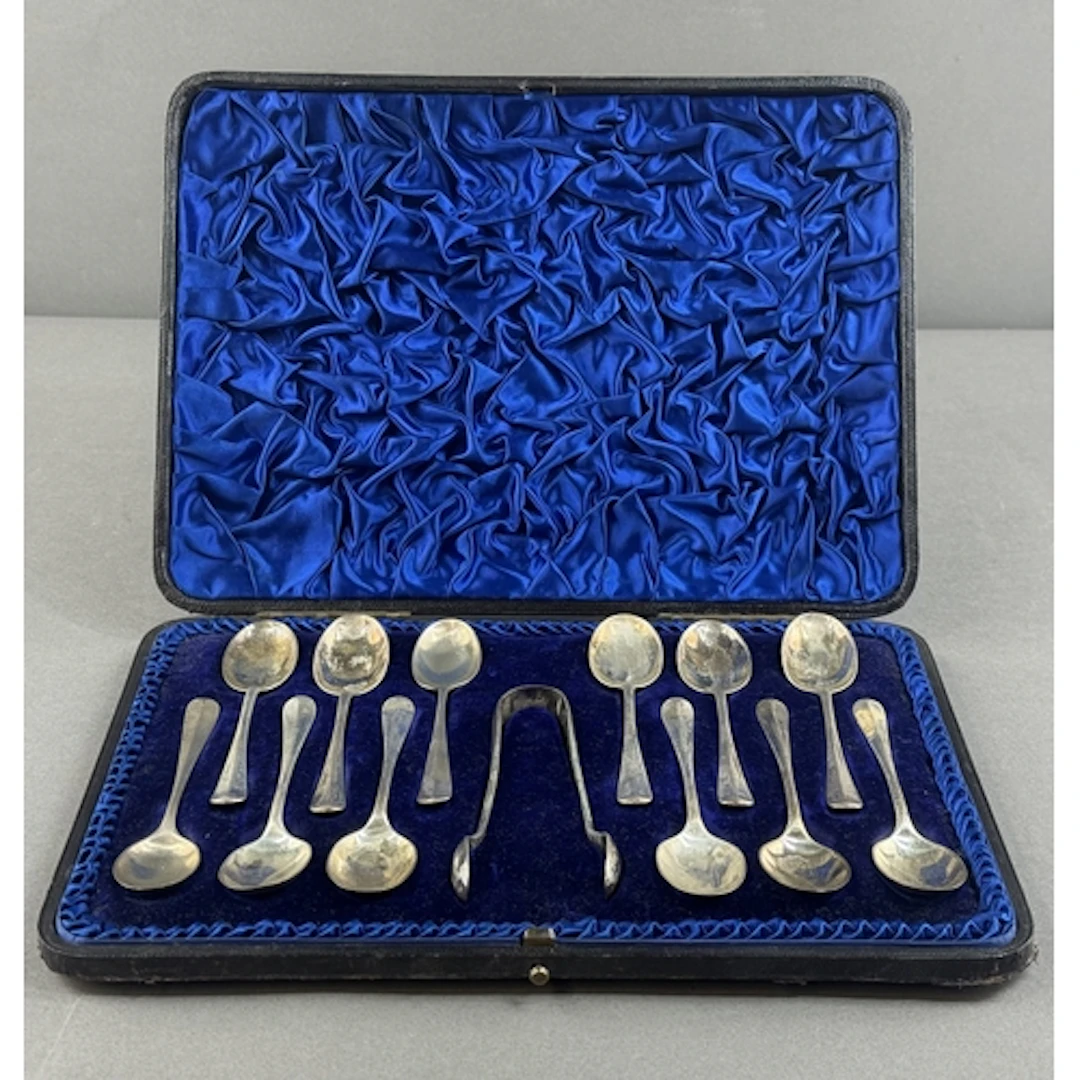 Silver: a set of twelve coffee spoons and tongs by Henry Atk...