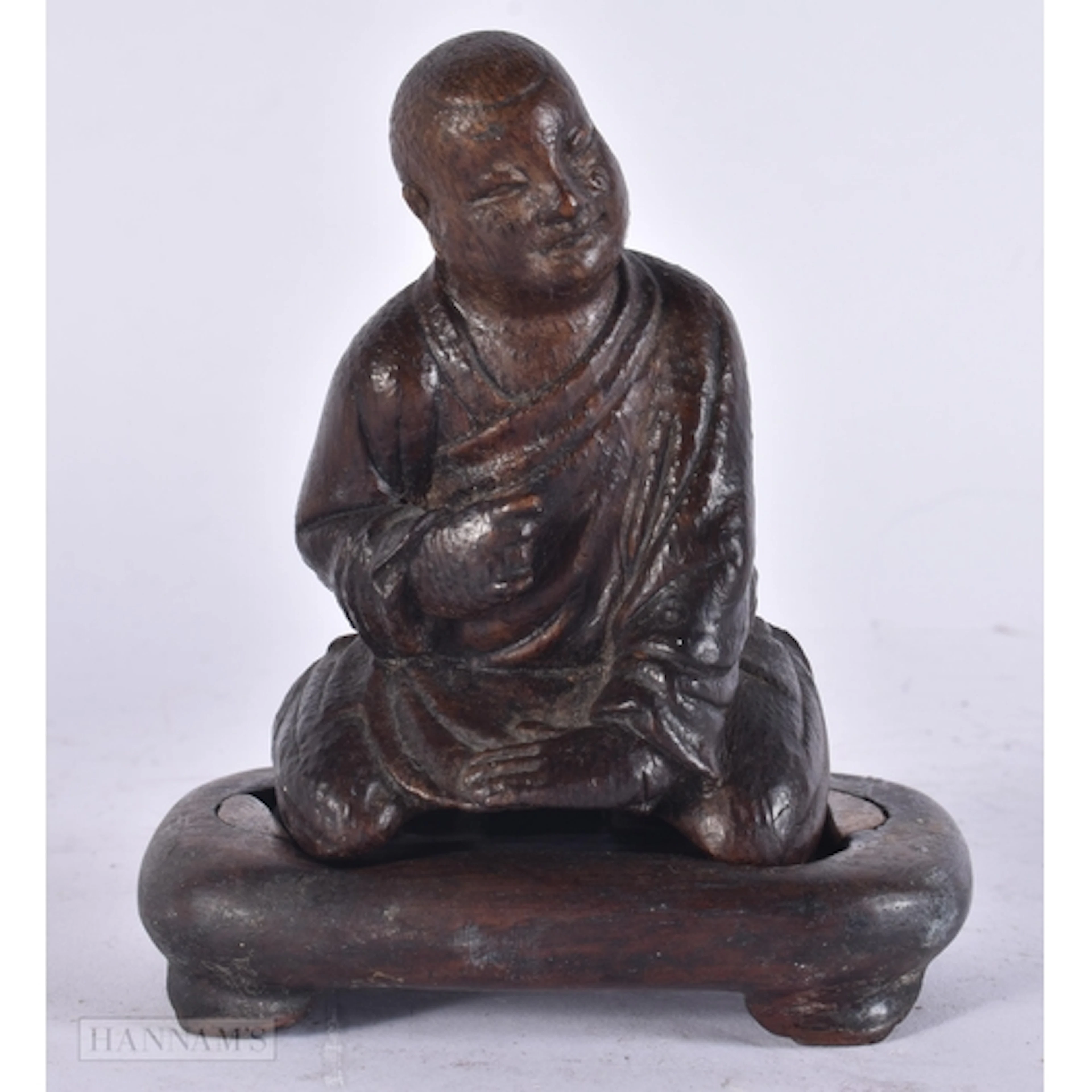 A CHINESE QING DYNASTY CARVED BAMBOO FIGURE OF A SCHOLAR. 9....