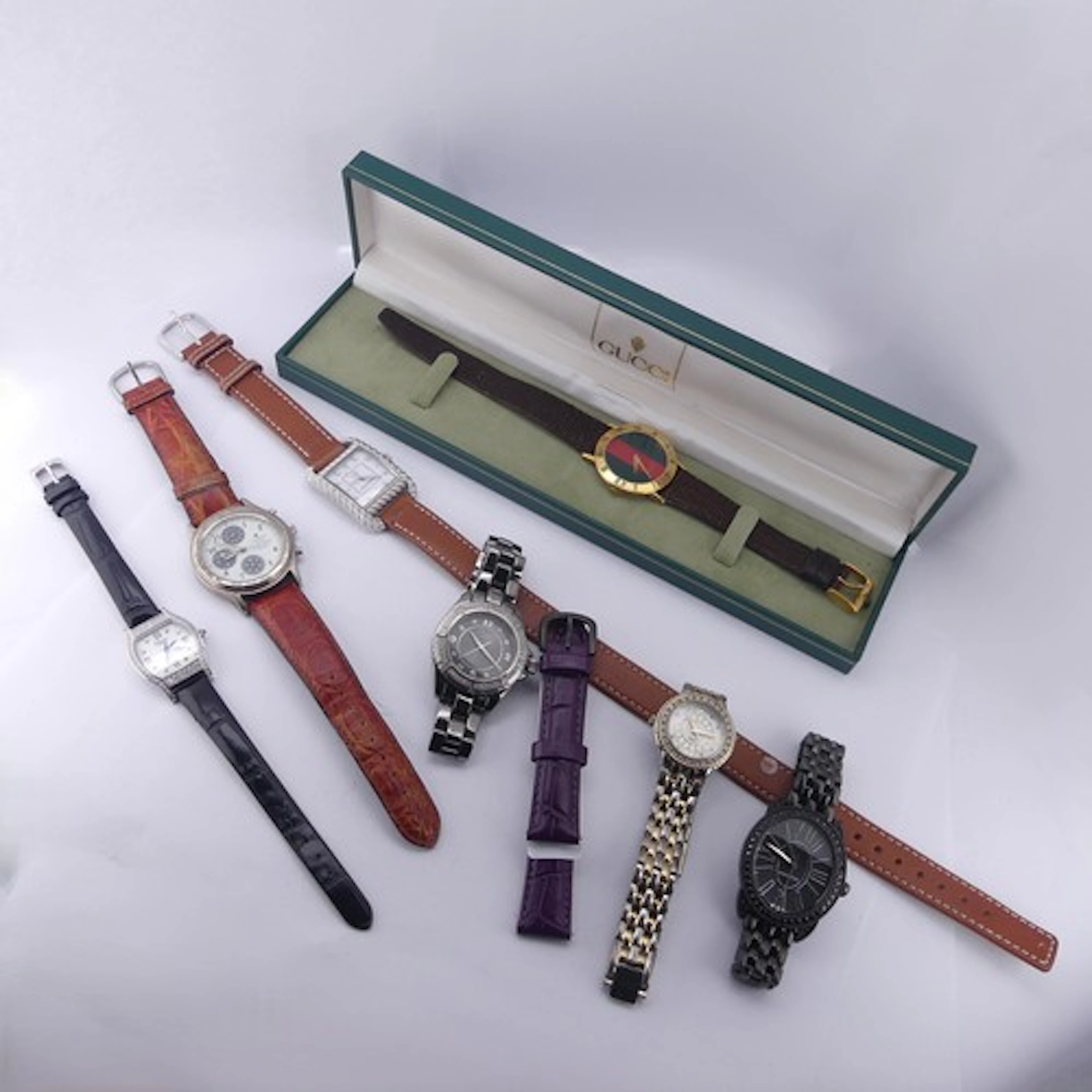 A cased Gucci 3000M Wristwatch, with guarantee card, not run...