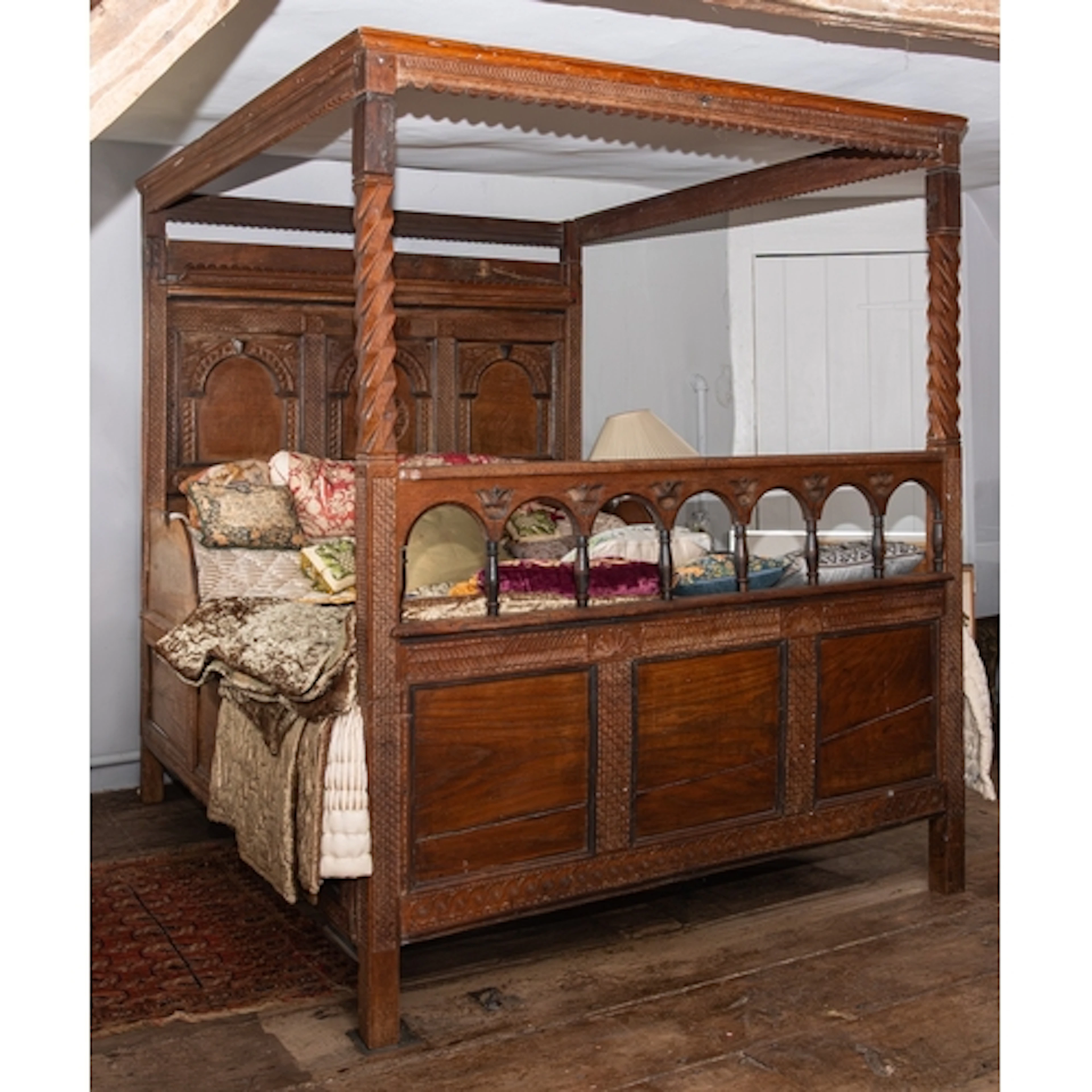 A George III carved oak tester bed, circa 1770 and later ele...