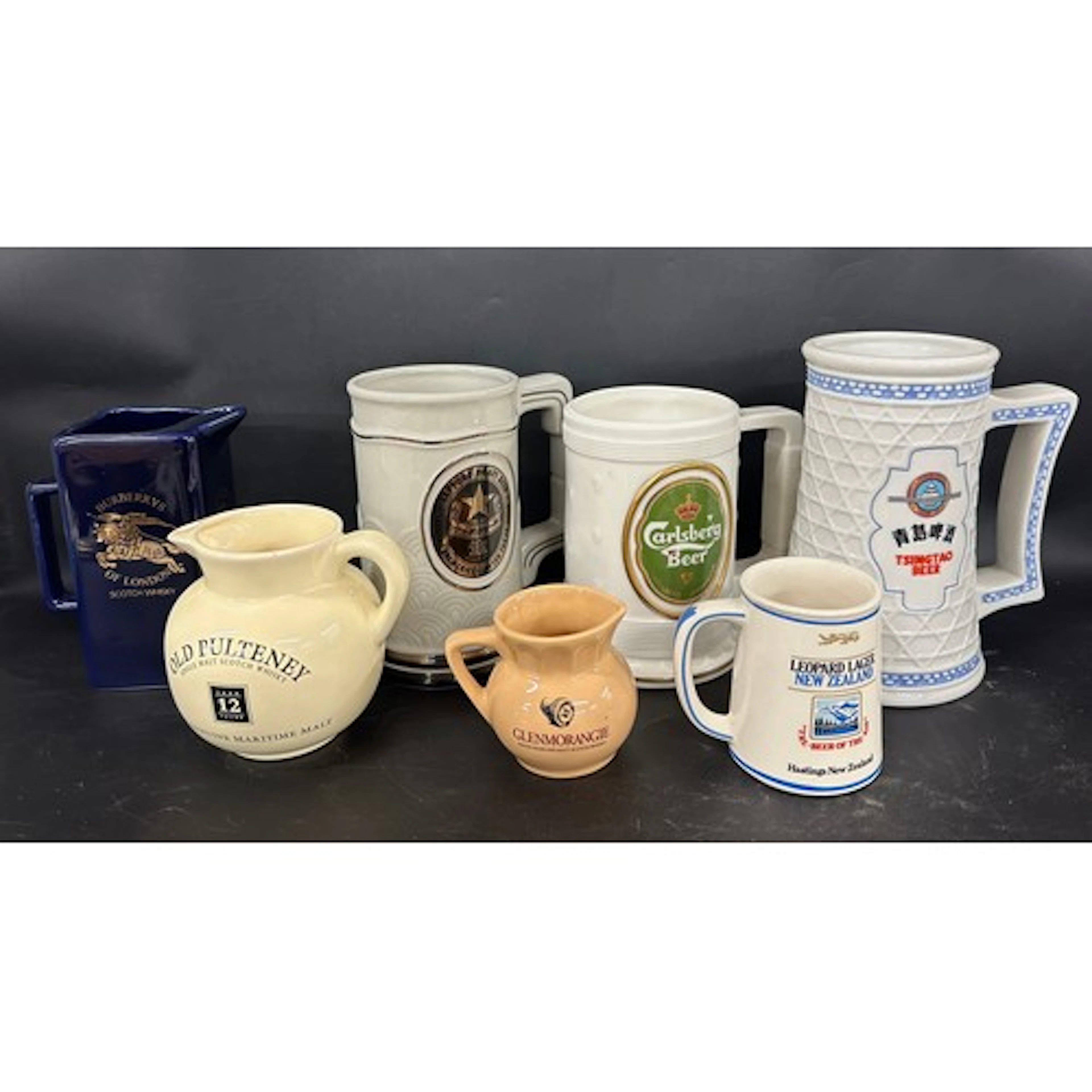 Four Great Breweries of the World tankards, and three bar ju...