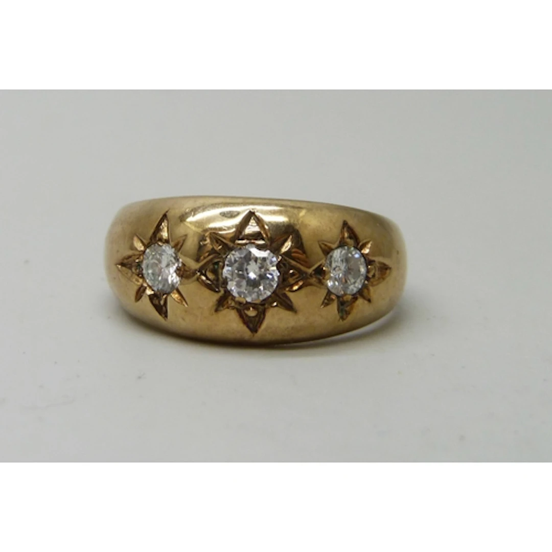 A 9ct gold Victorian style gypsy ring set with three diamond...