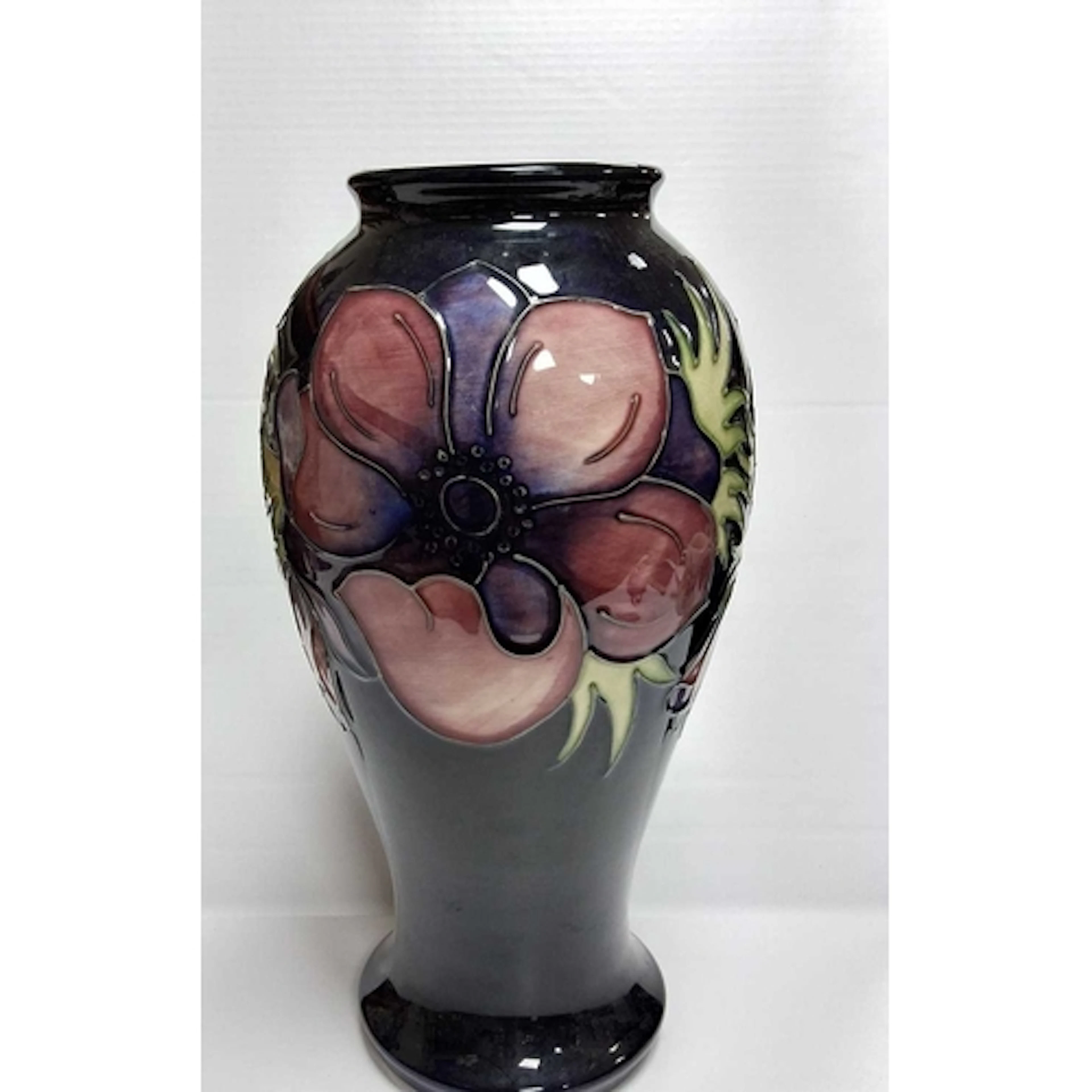 A MOORCROFT POTTERY ANEMONE VASE, featured in a baluster/hou...