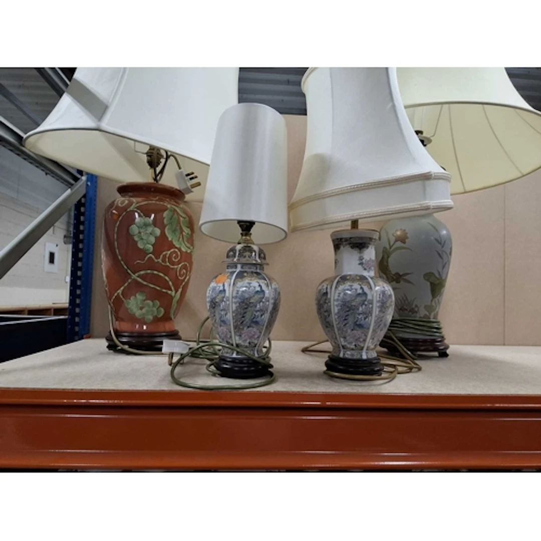 A SMALL GROUP OF FOUR TABLE LAMPS AND A STANDARD LAMP to inc...