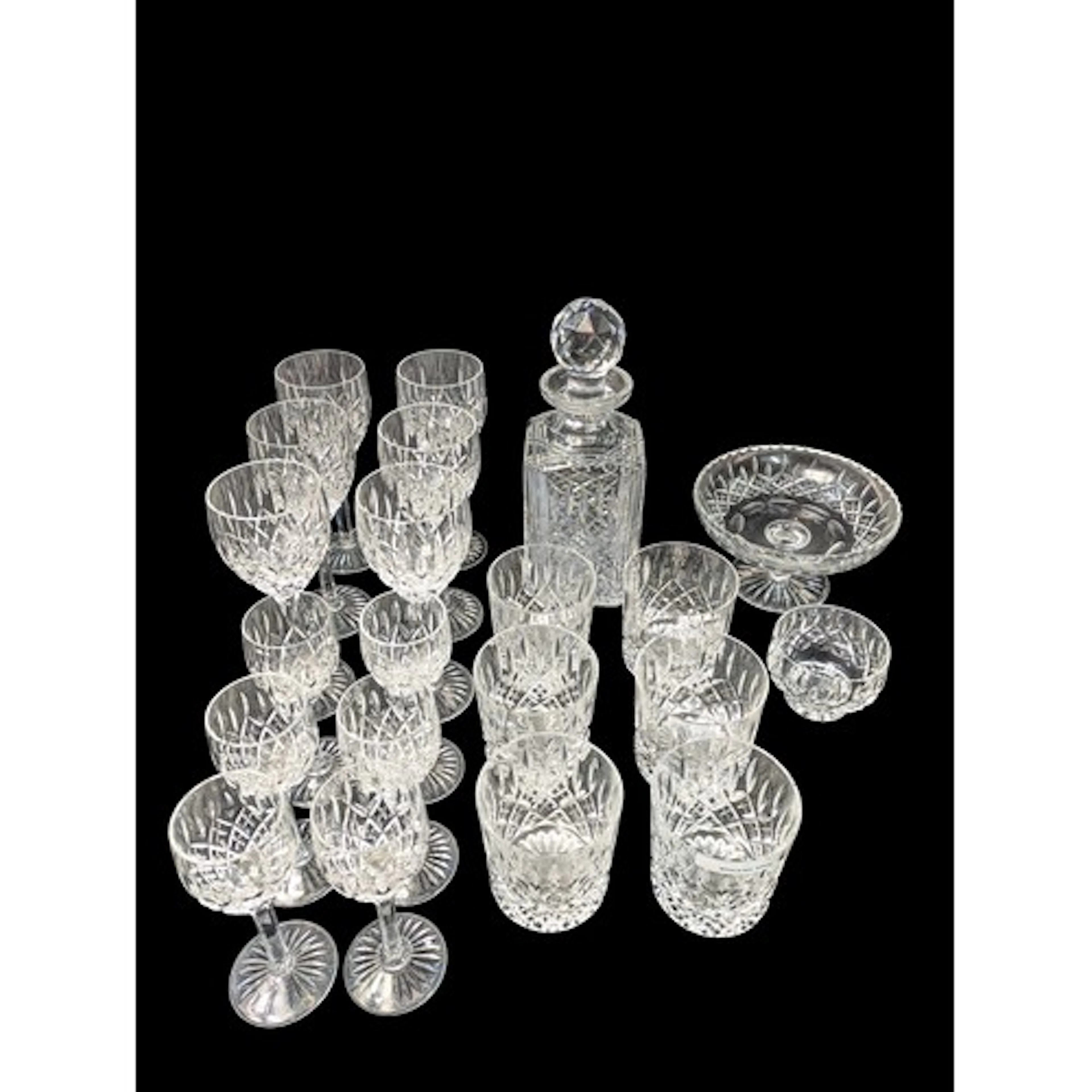 A quantity of cut crystal, including a square-section decant...