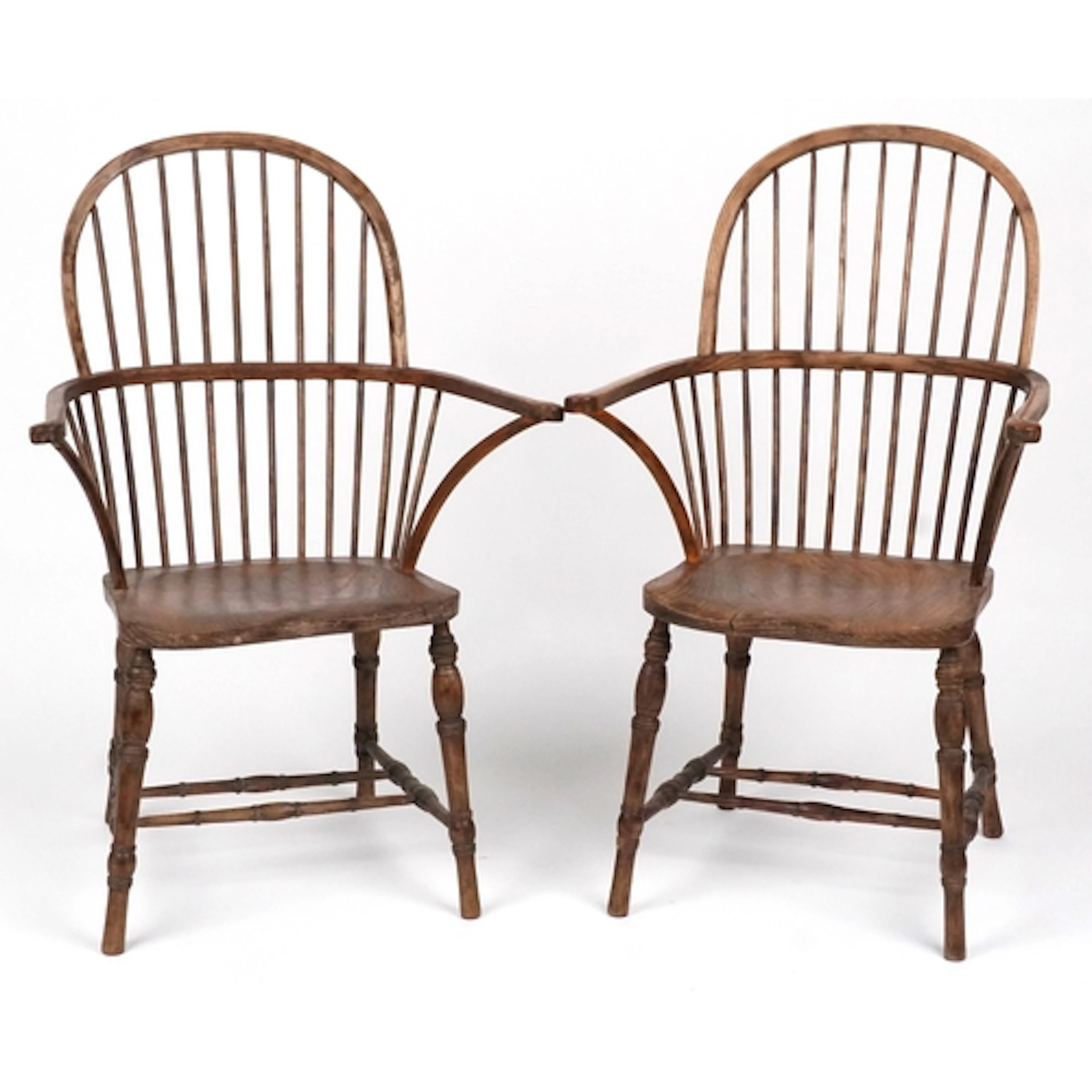 Pair of ash and elm Windsor armchairs with arched spindle ba...