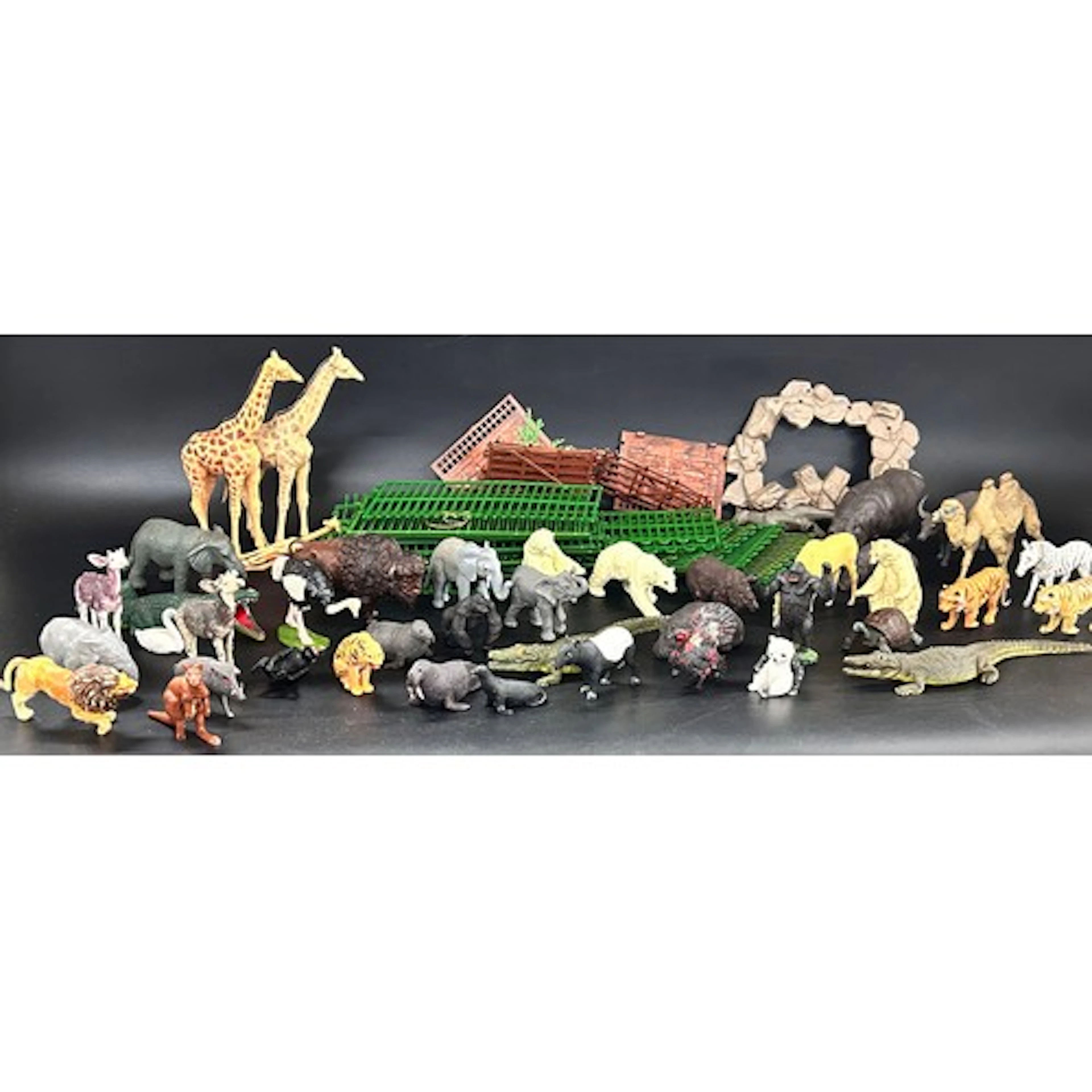 A collection of vintage zoo animal toy figures including Bri...