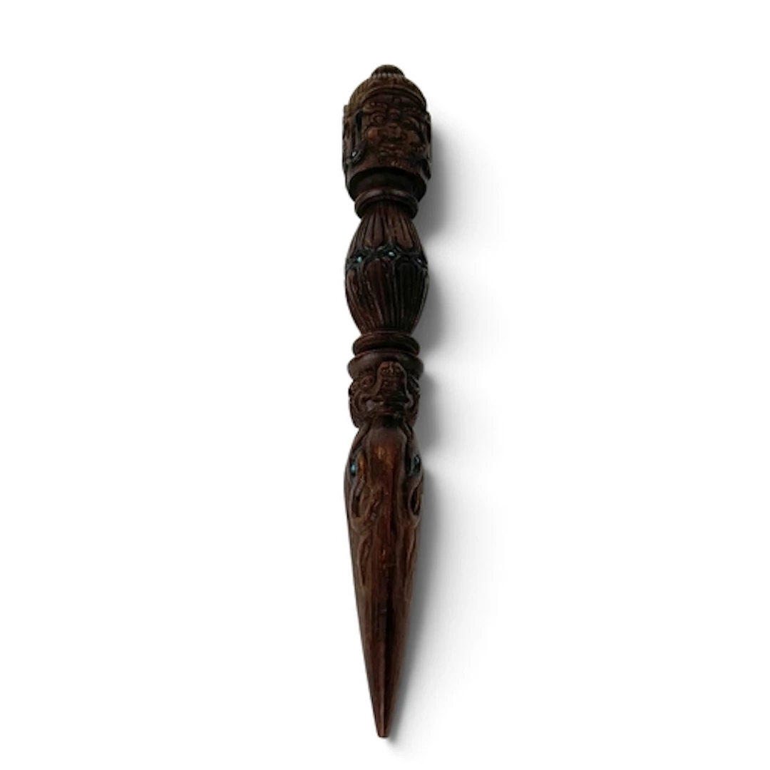 AN EARLY 20TH CENTURY TIBETAN CARVED WOODEN PURBA Inset with...