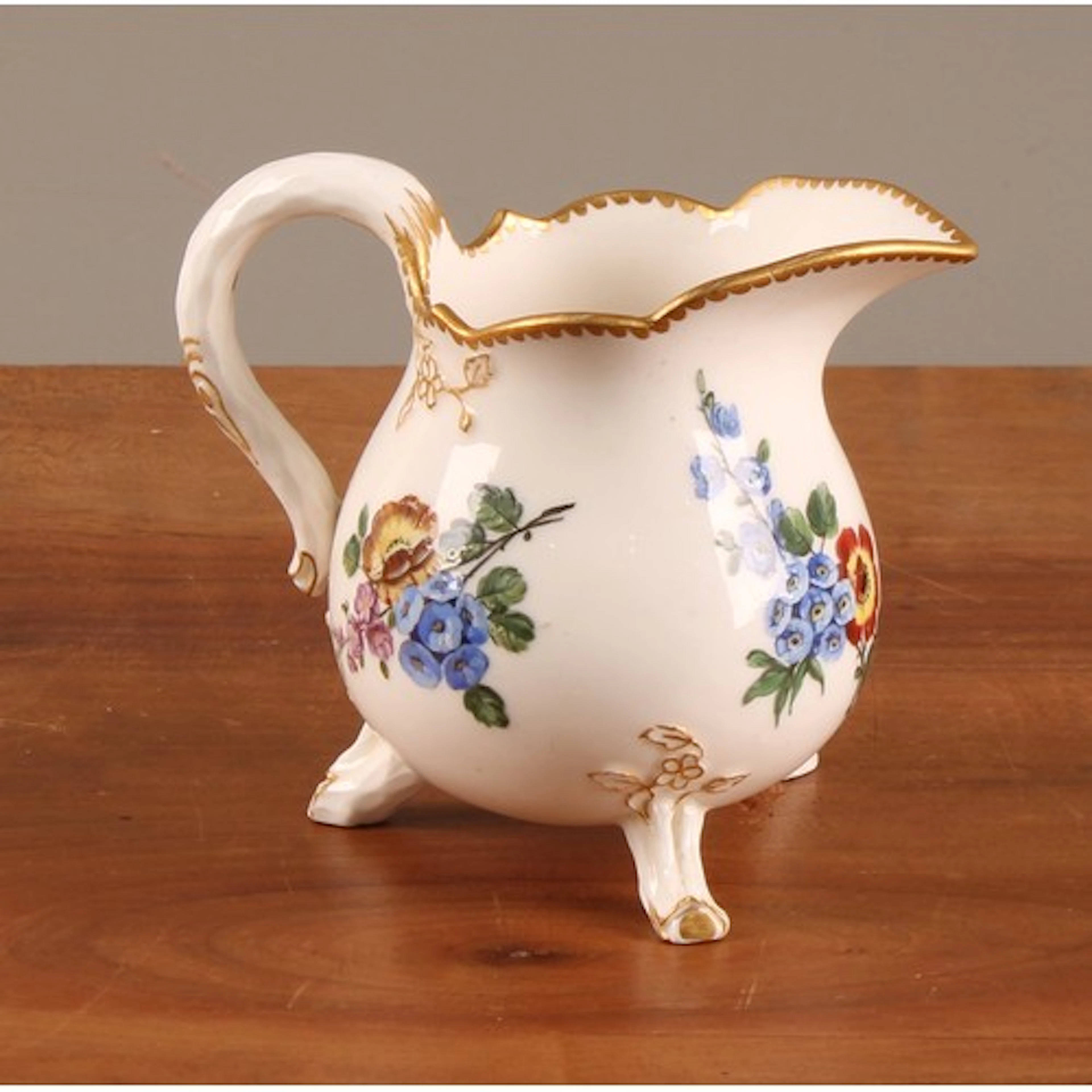 A Continental porcelain baluster cream jug, probably Sevres,...