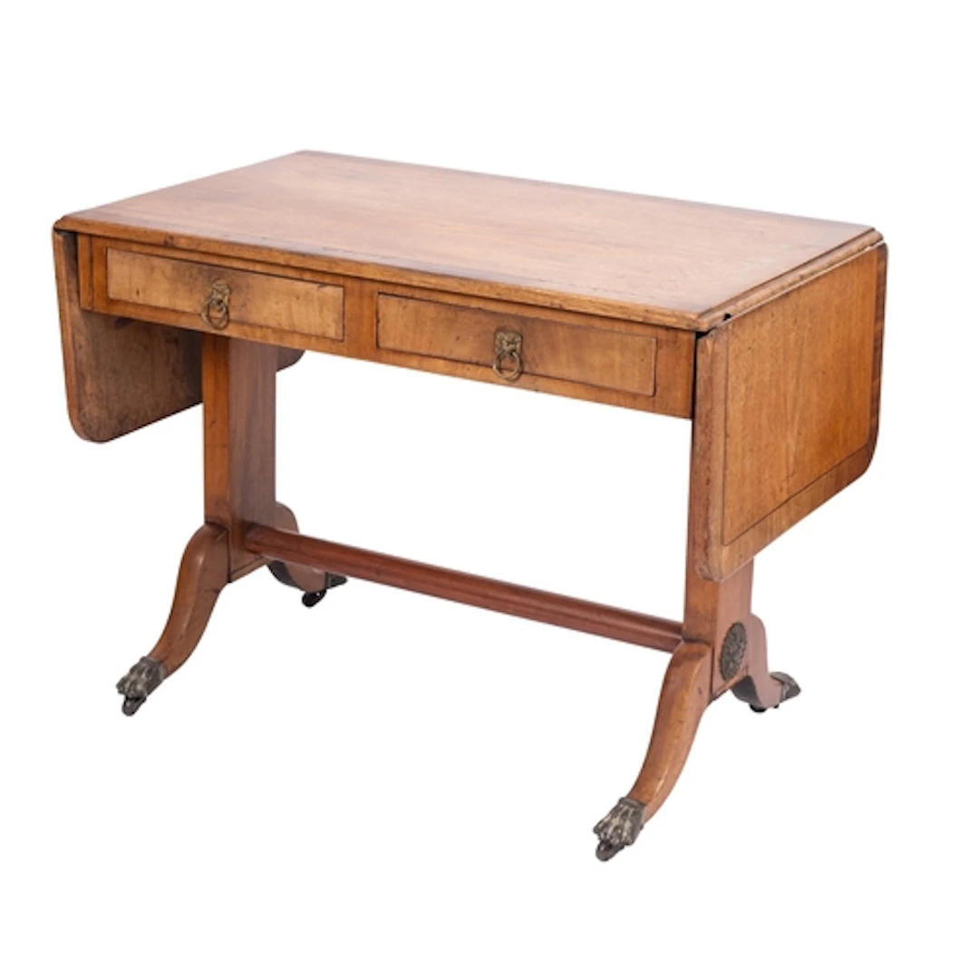 A Regency fruitwood and walnut banded sofa table, early 19th...