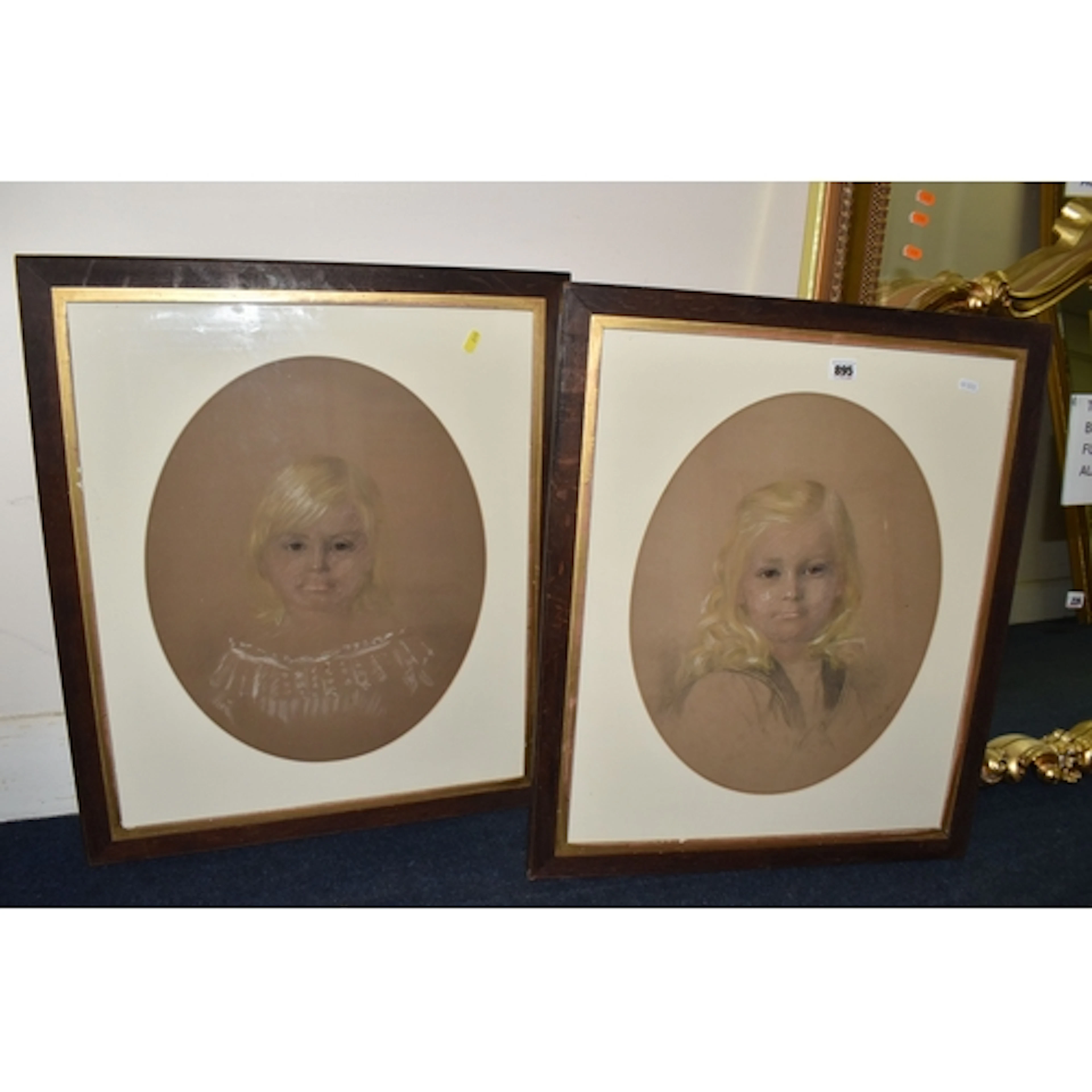 TWO VICTORIAN PORTRAITS OF YOUNG GIRLS, the first depicts a ...