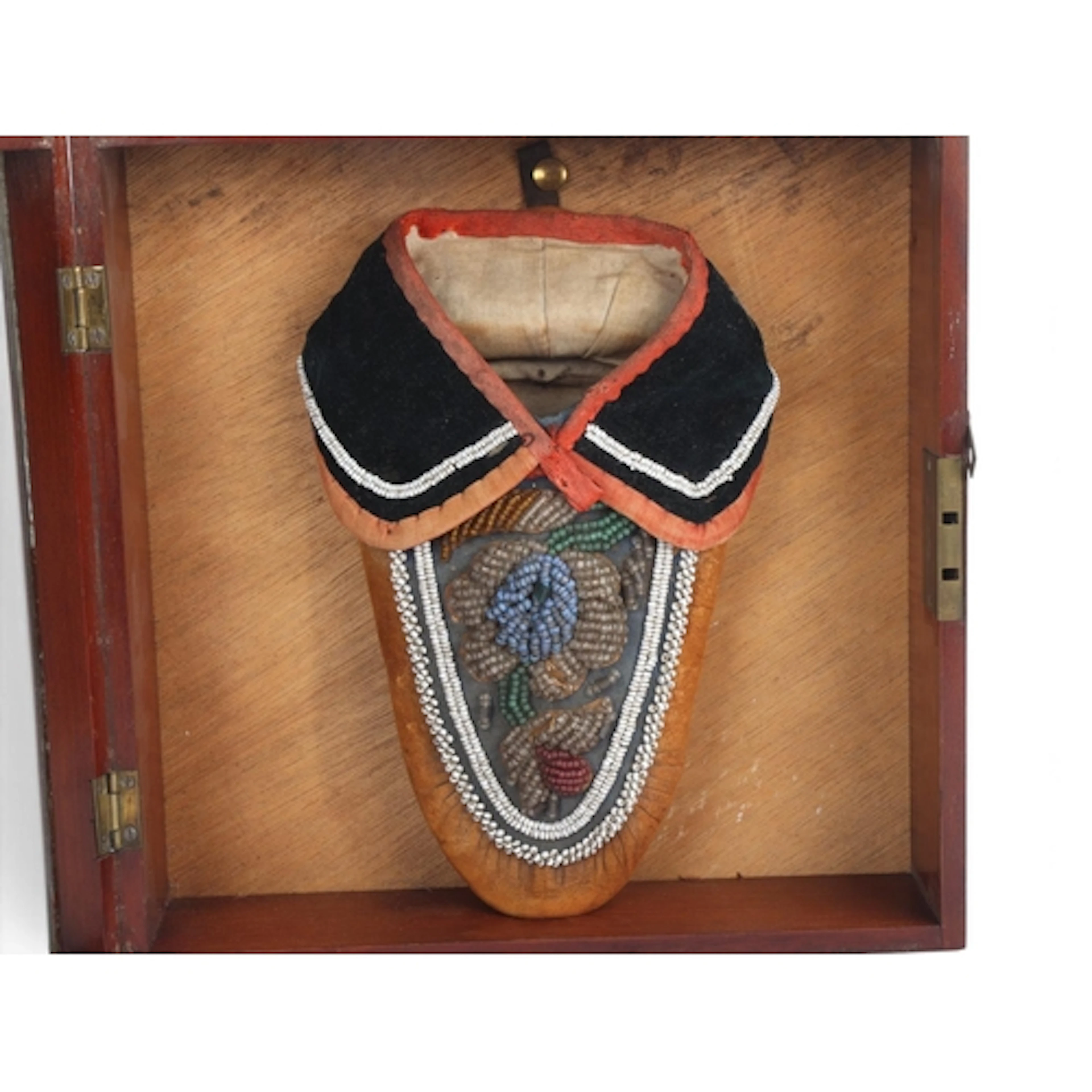 An Iroquois Native American beaded hide moccasin, length 23c...