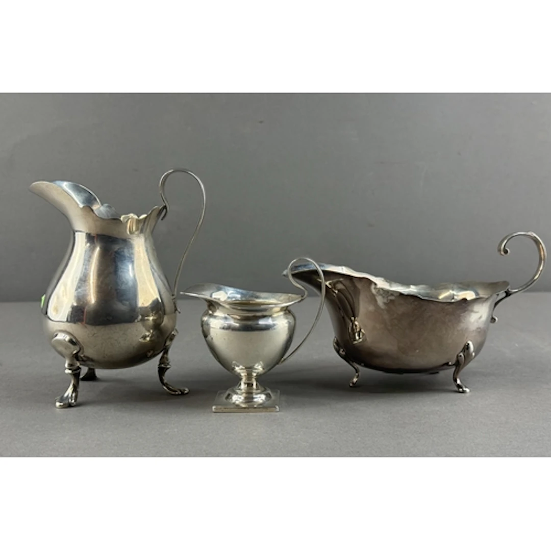 Silver: a sauce boat by William Suckling, Birmingham 1936; a...