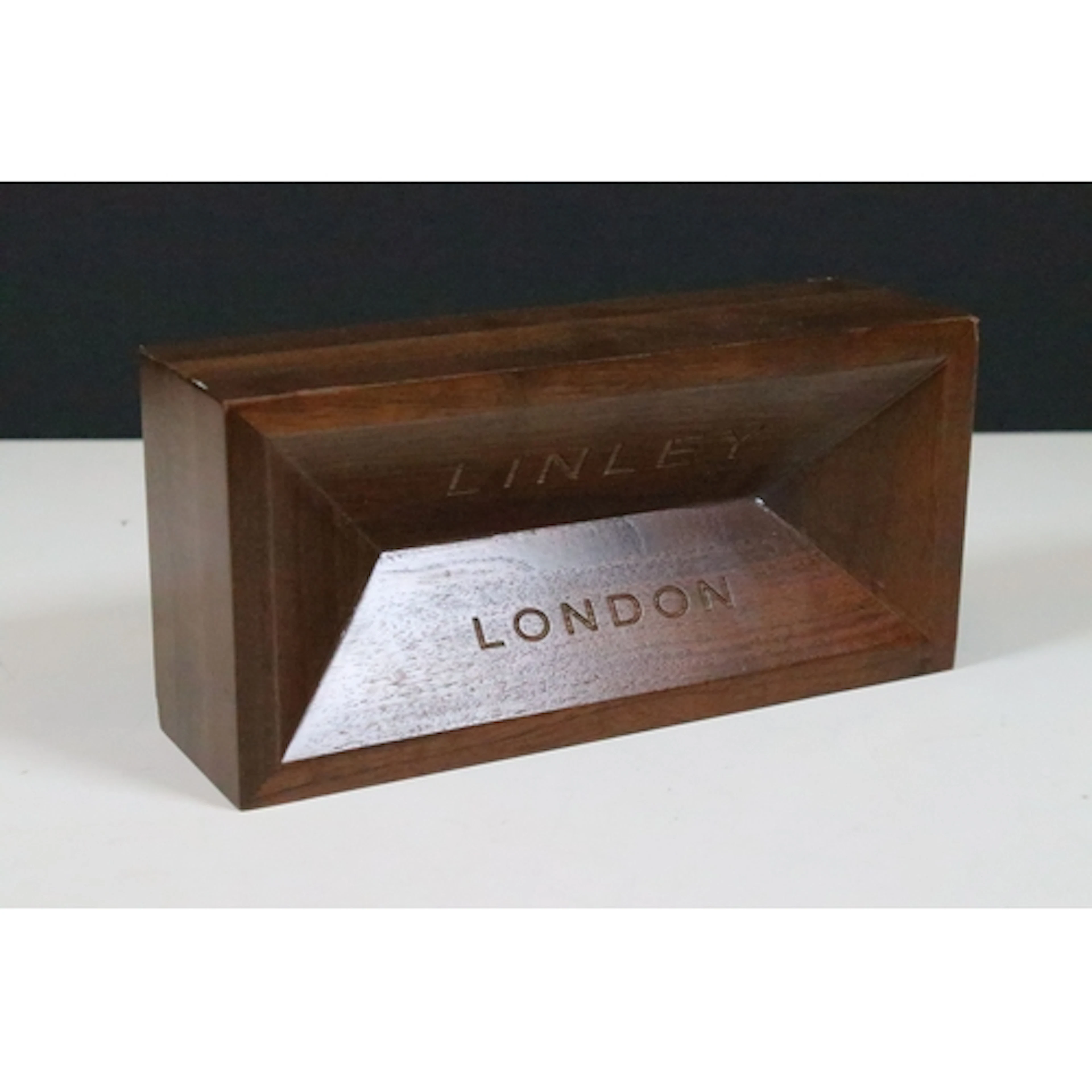 David Linley 'Brick' doorstop or paperweight, having a white...