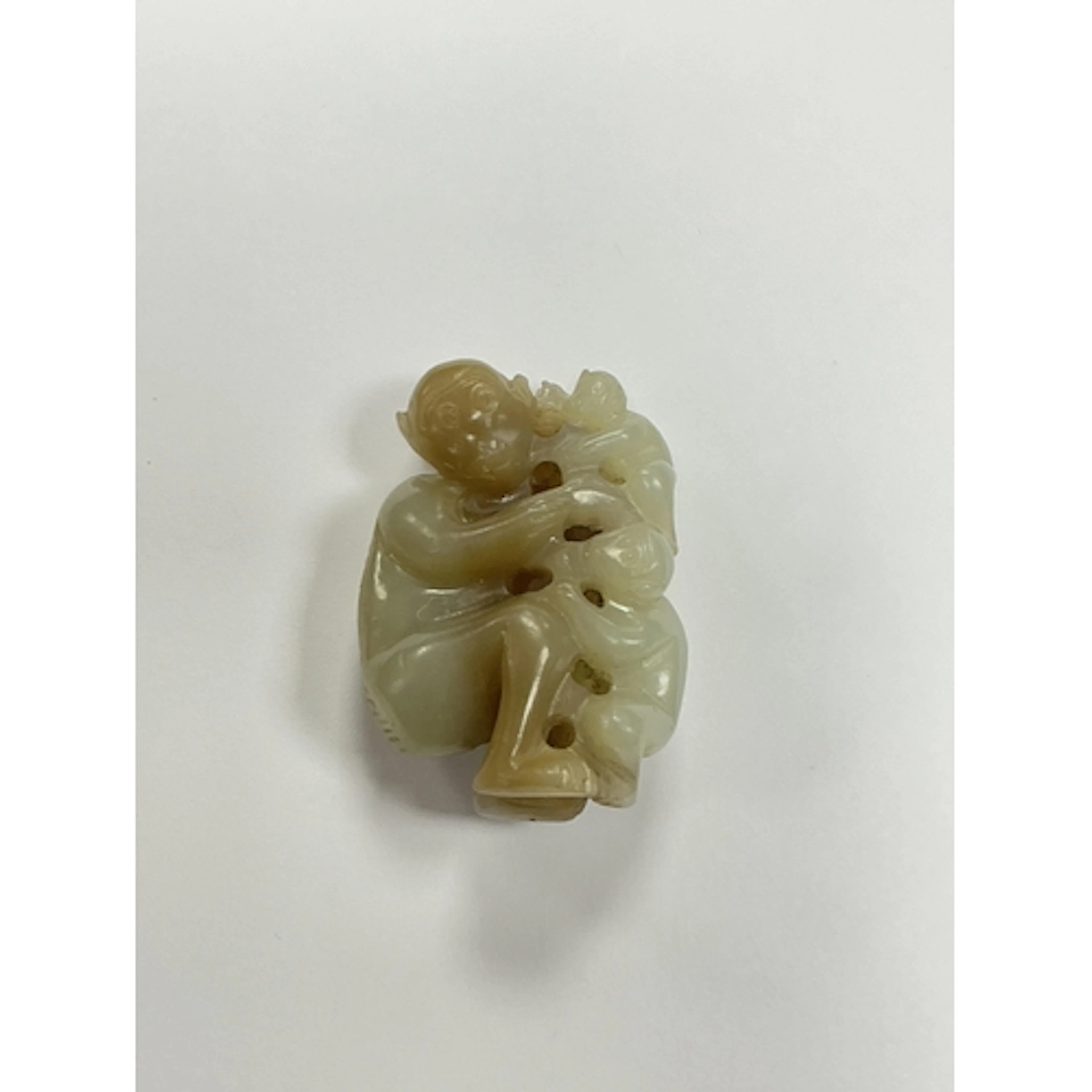 A Chinese pale celadon and brown jade monkey group, length 5...