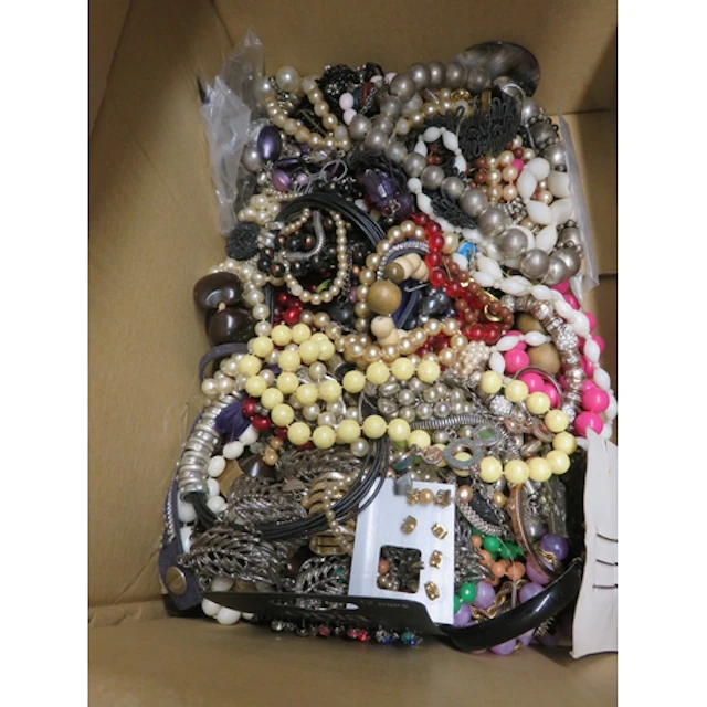 Five boxes containing a quantity of various costume jeweller...