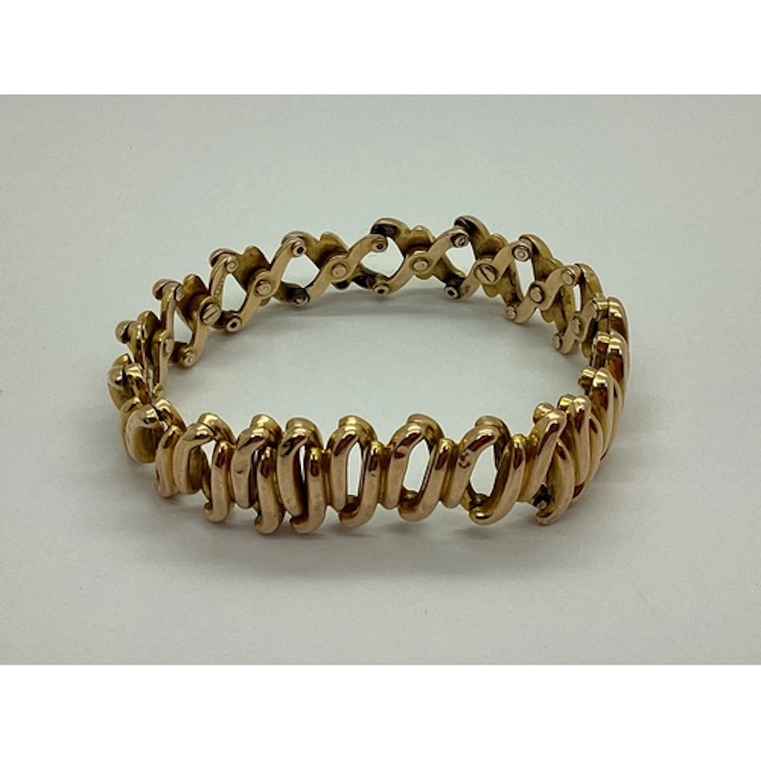 An Antique Expanding Bracelet, of concertina style, stamped ...