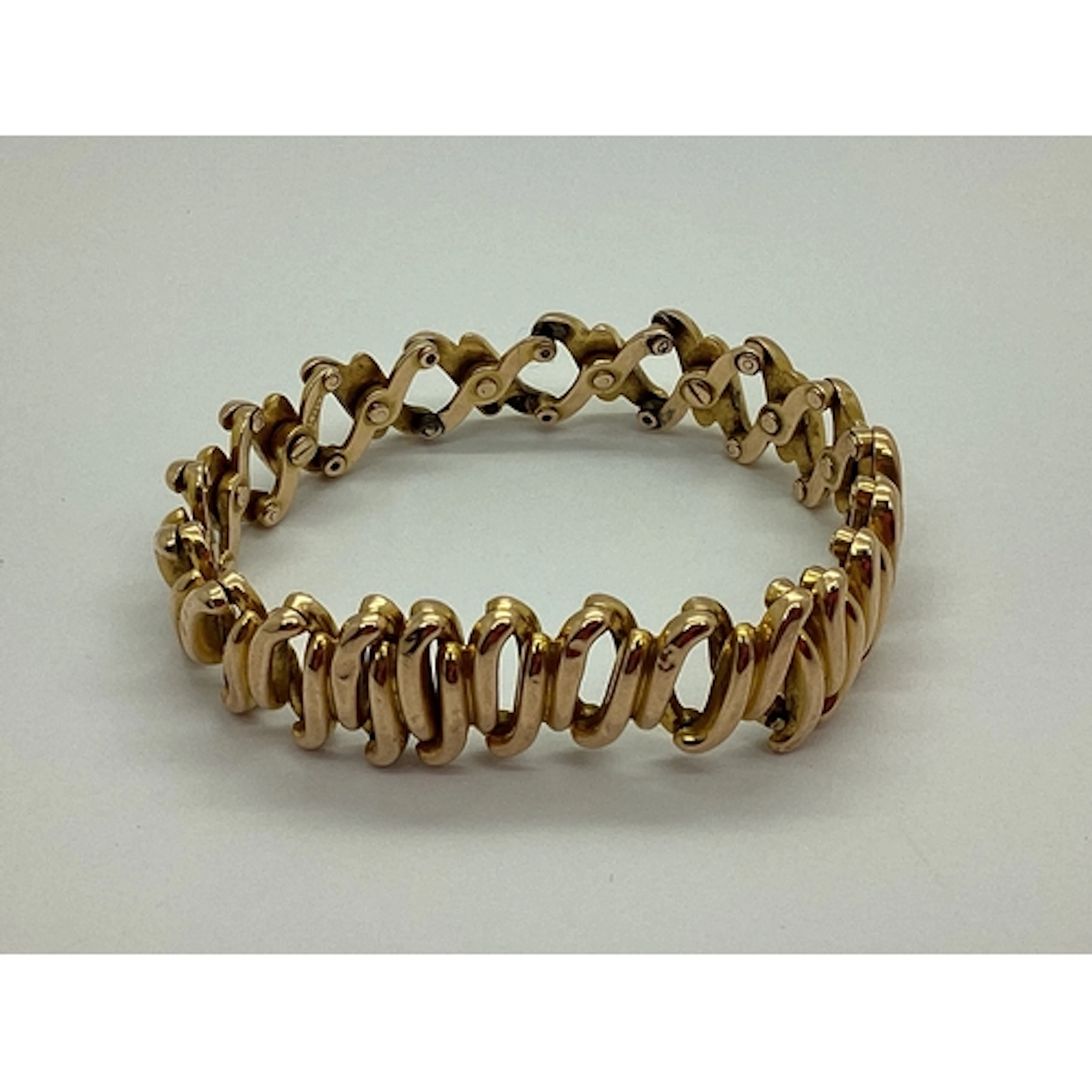 An Antique Expanding Bracelet, of concertina style, stamped ...