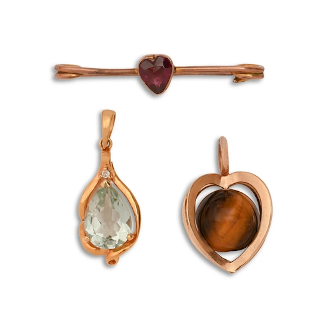 A tiger eye bead pendant, in gold, 2.3cm h, marked 9K, a pea...