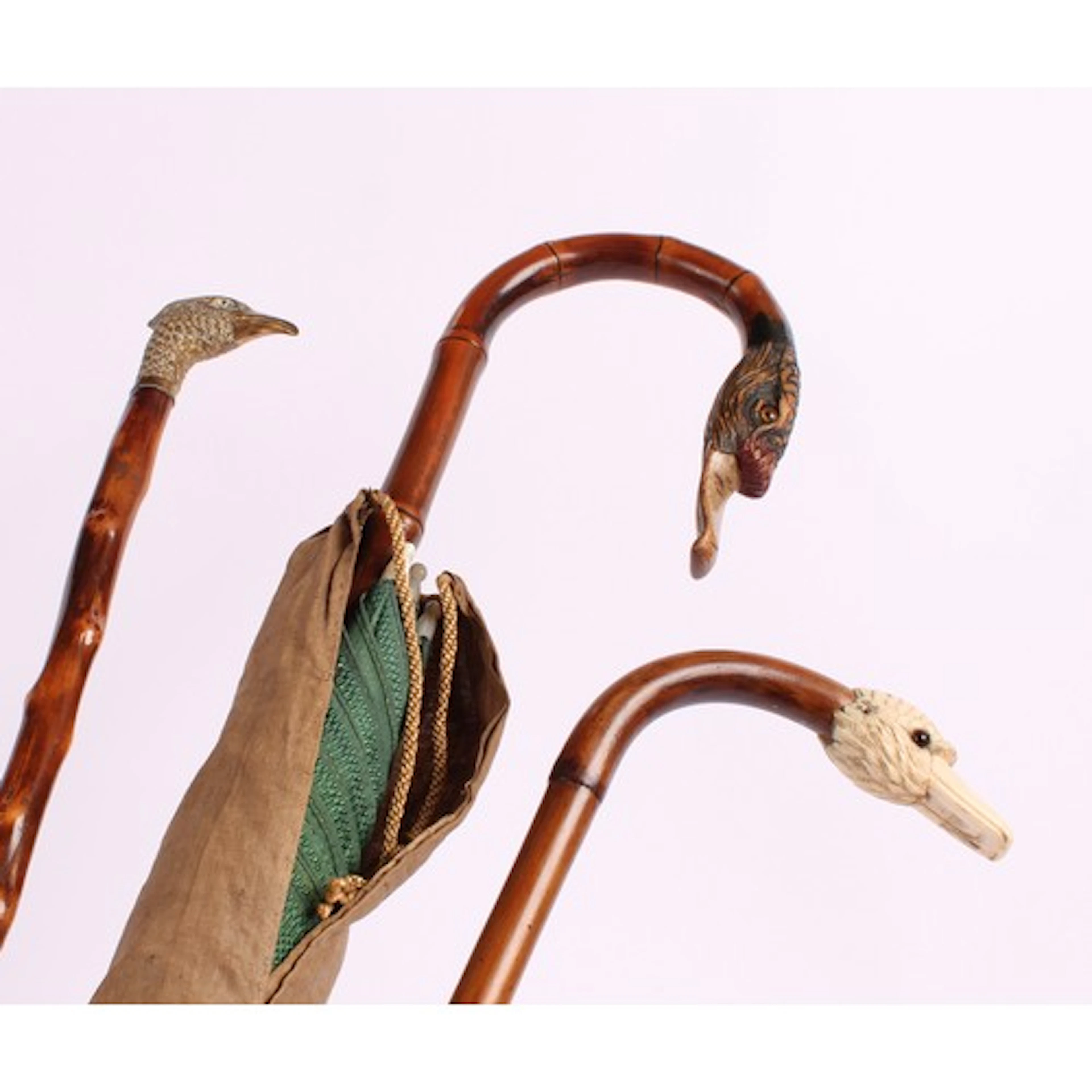 A Edwardian walking stick, the brass handle cast as a Peacoc...