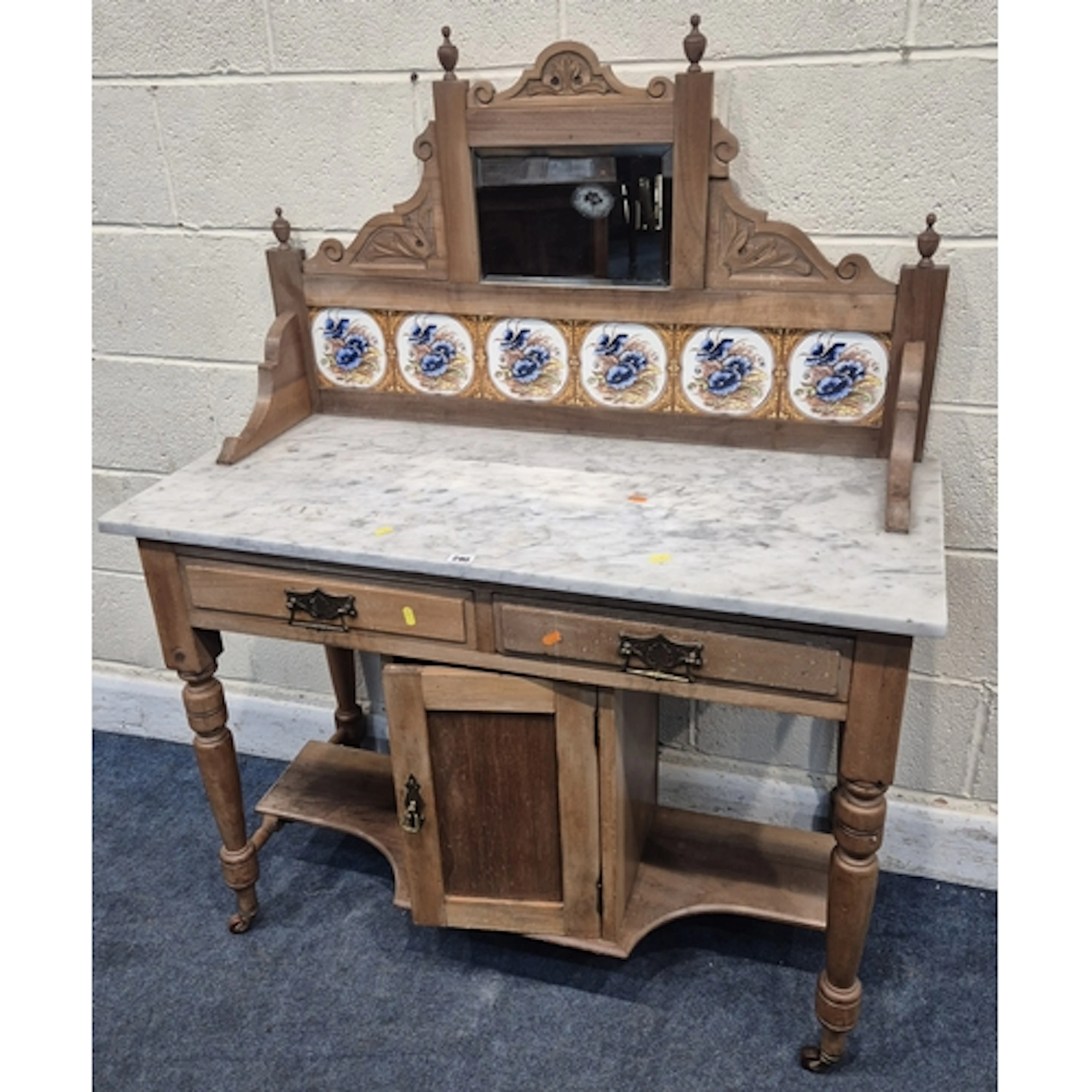 AN EDWARDIAN PINE MARBLE TOP WASH STAND, the raised back wit...