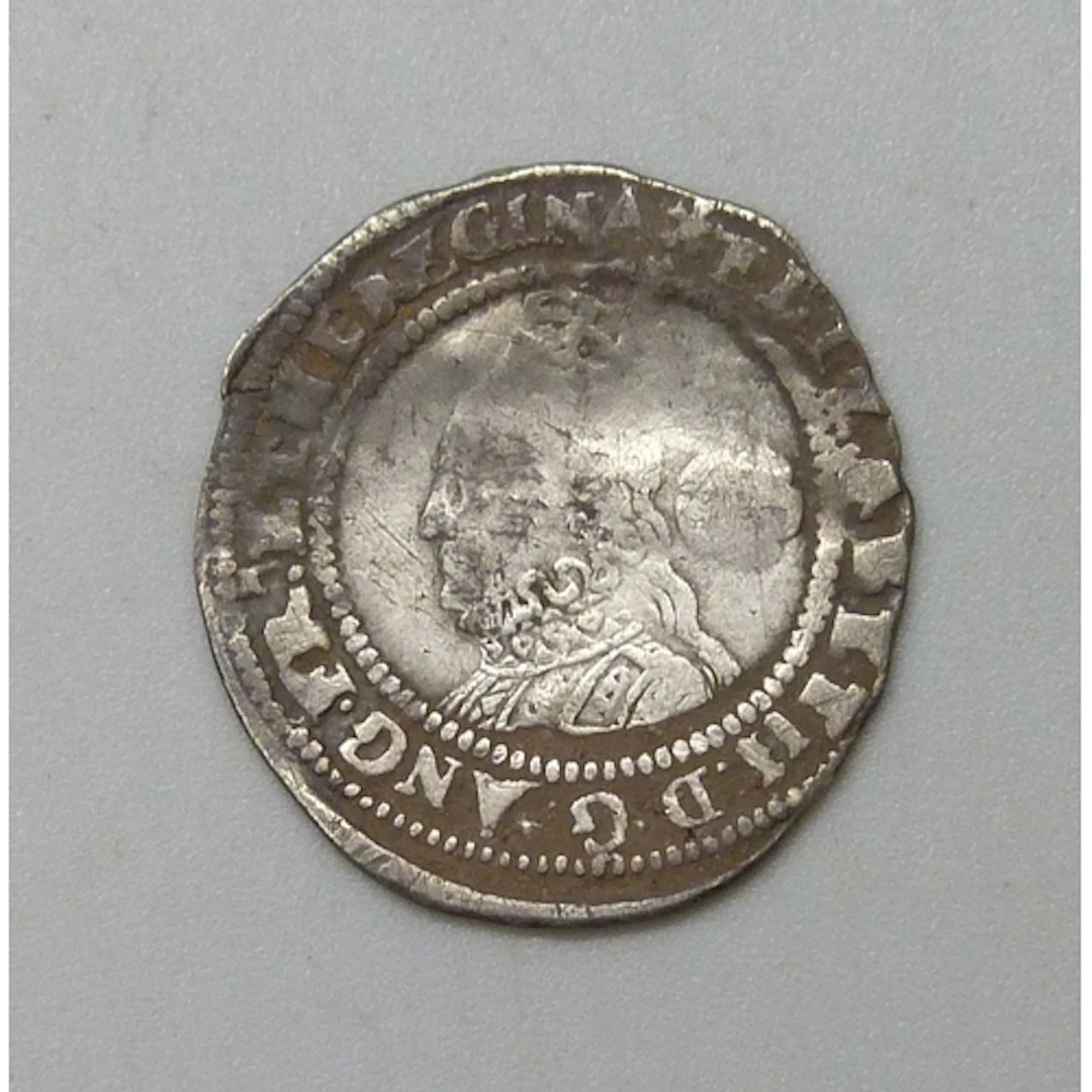 Coins - an Elizabeth I threepence M.M. Eglantine, dated 1574...