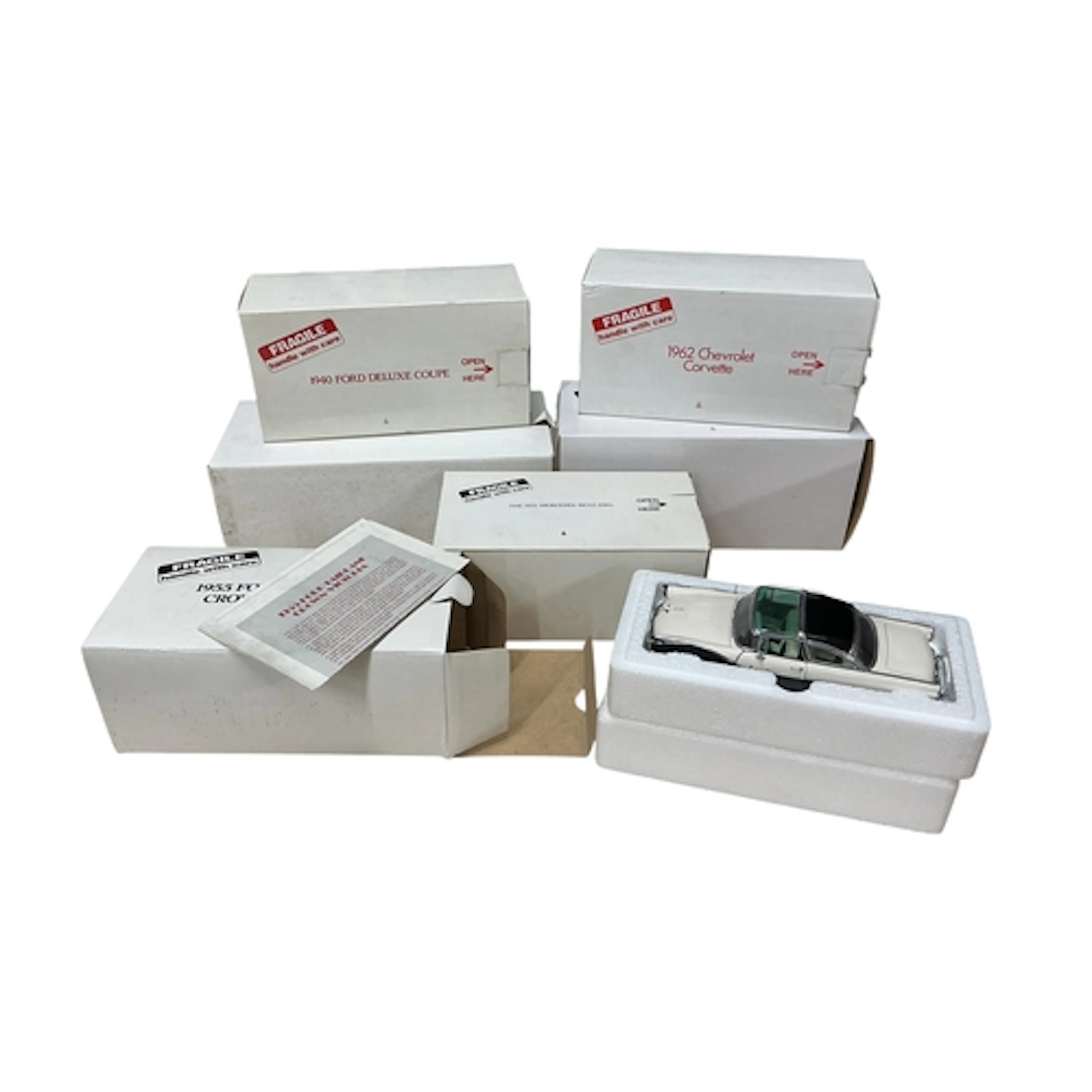 Six boxed Danbury Mint model vehicles; a 1955 Ford Fairlane ...
