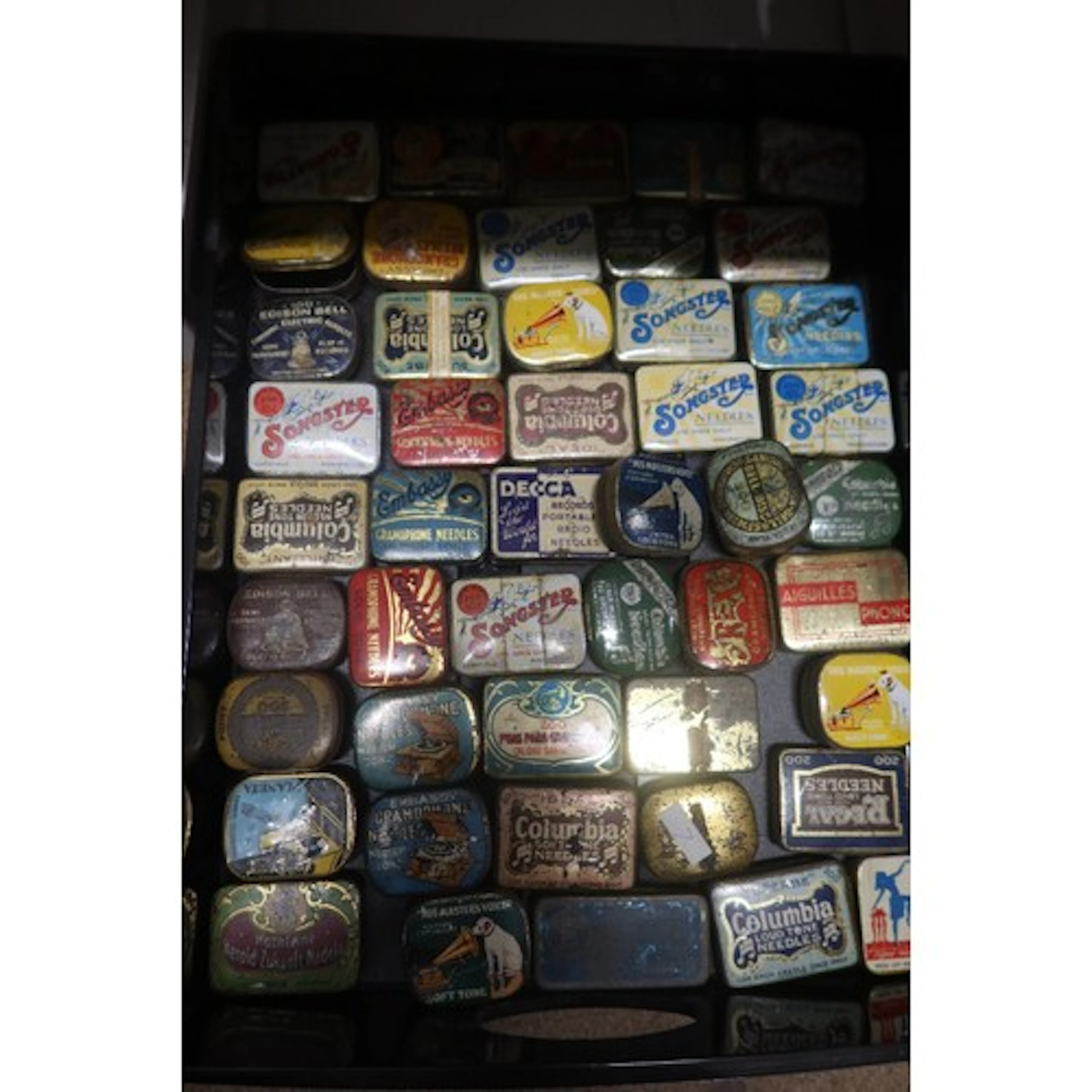 A tray of vintage gramphone needle tins