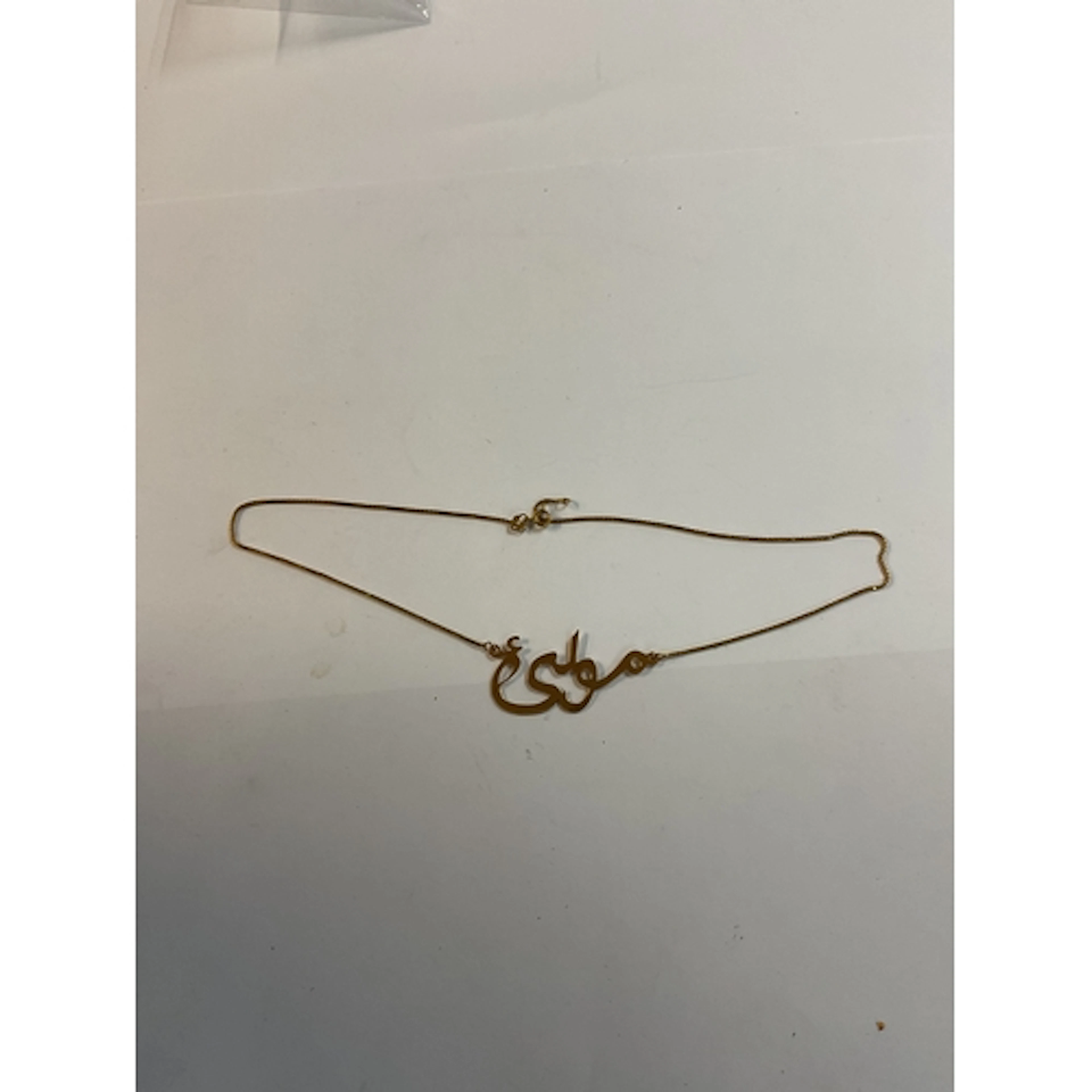 18 ct Asian motif pendant and necklace. Weight 5 grams