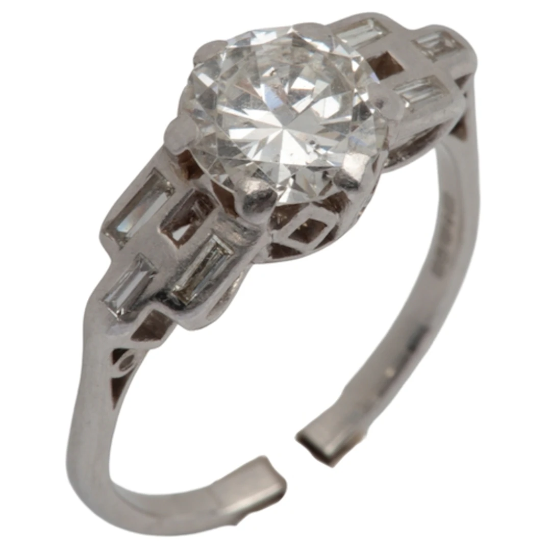 A diamond ring, circa 1935, claw-set with a transitional cir...