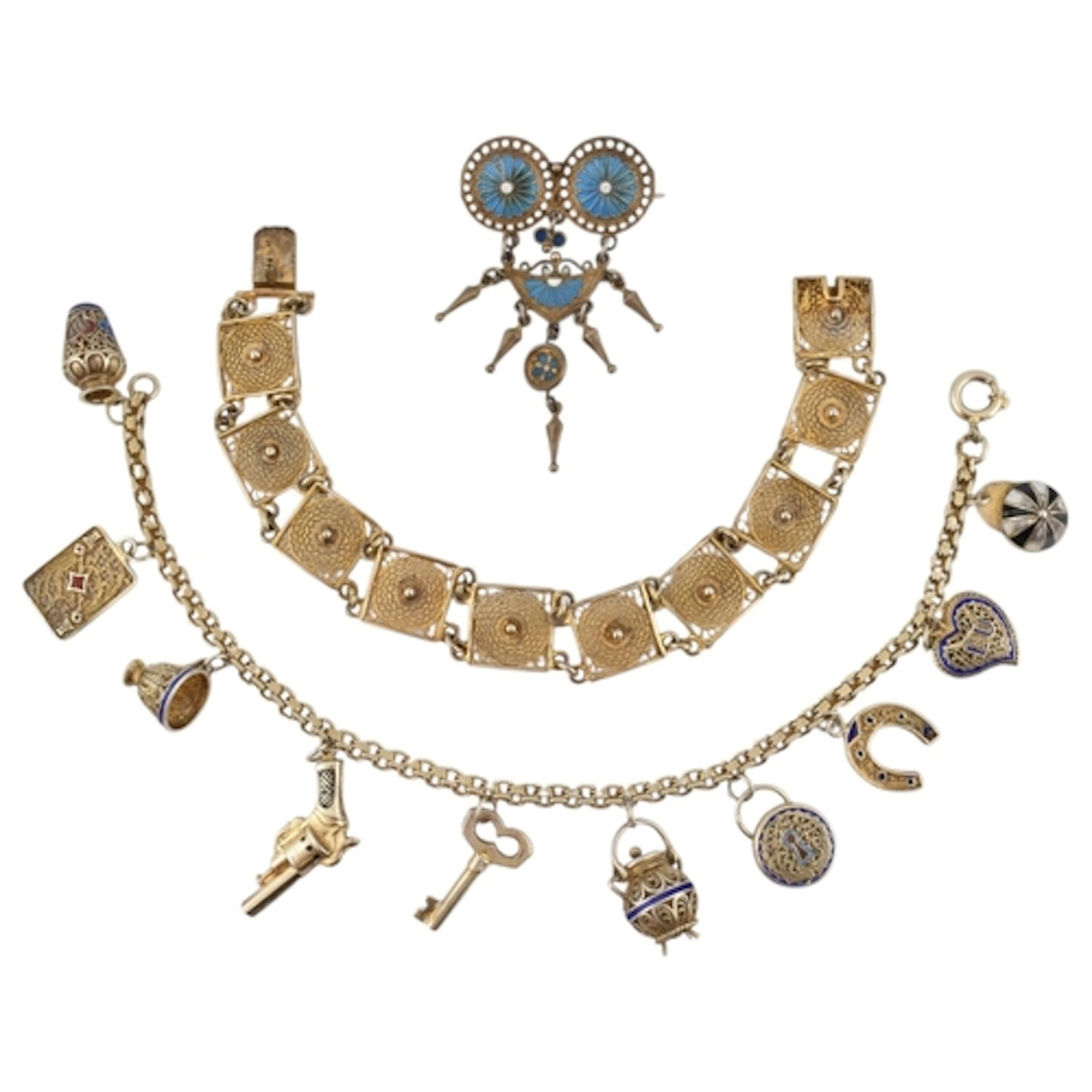 Two Portuguese bracelets and a brooch pin. A silver charm br...
