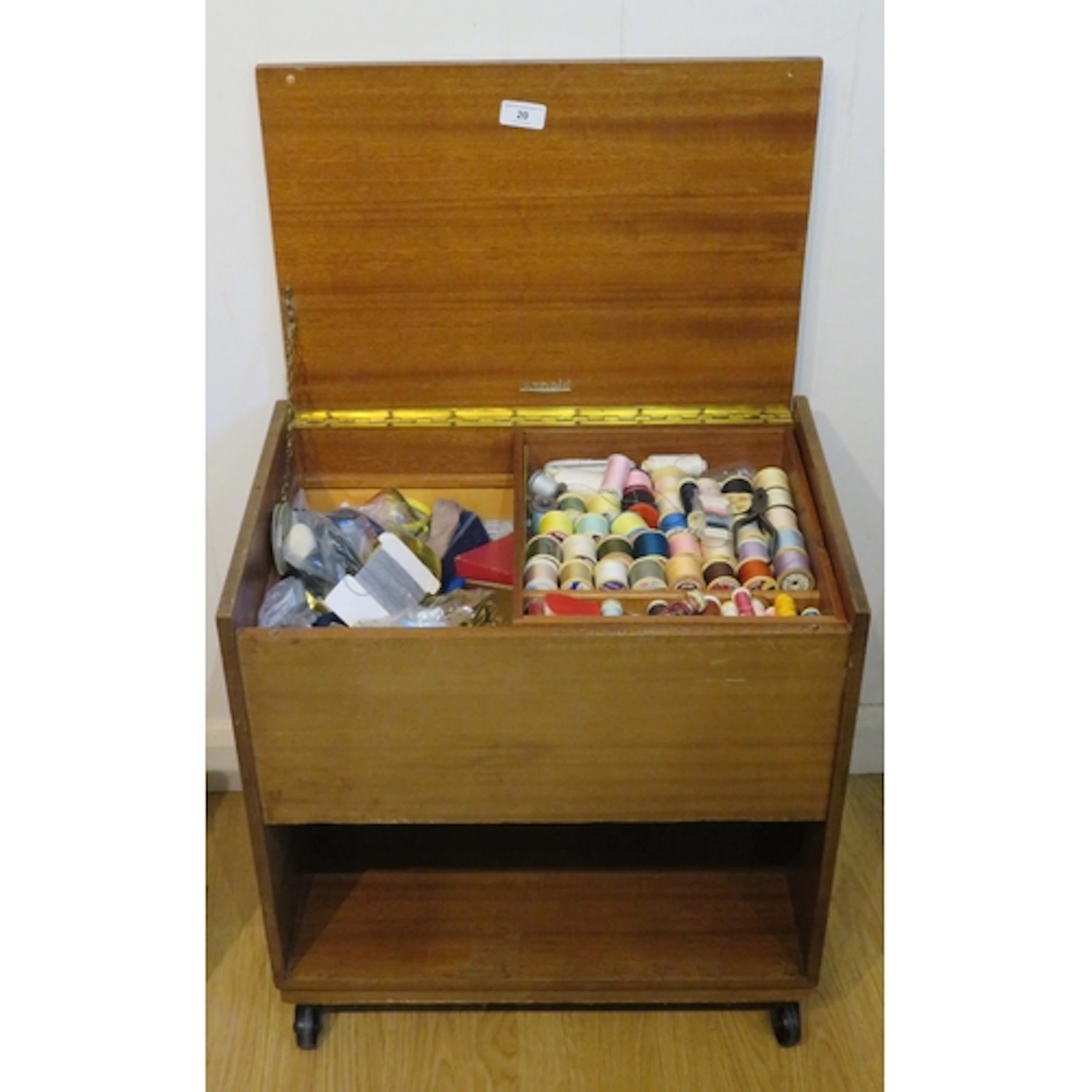 Teak sewing box, by Arnold of Marlow, containing a collectio...