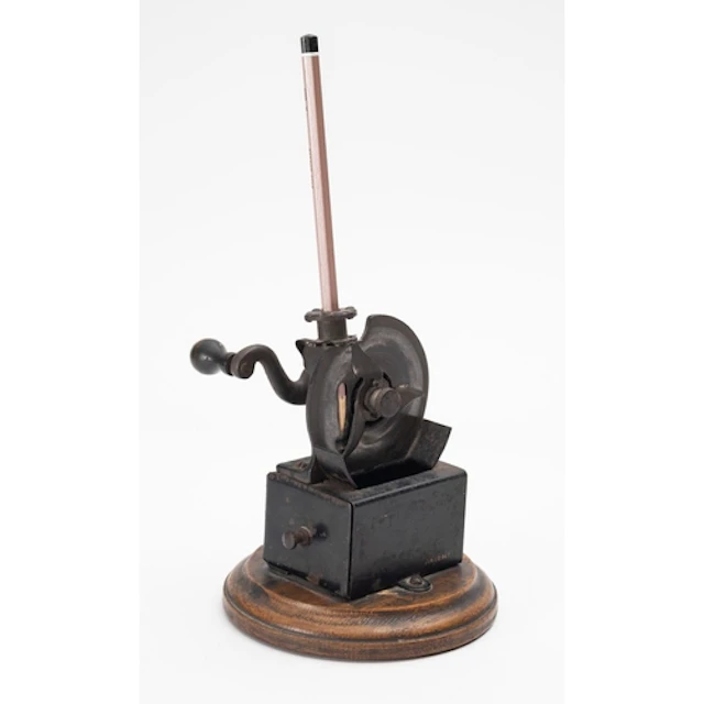 An early 20th Century mechanical pencil sharpener. Stamped A...