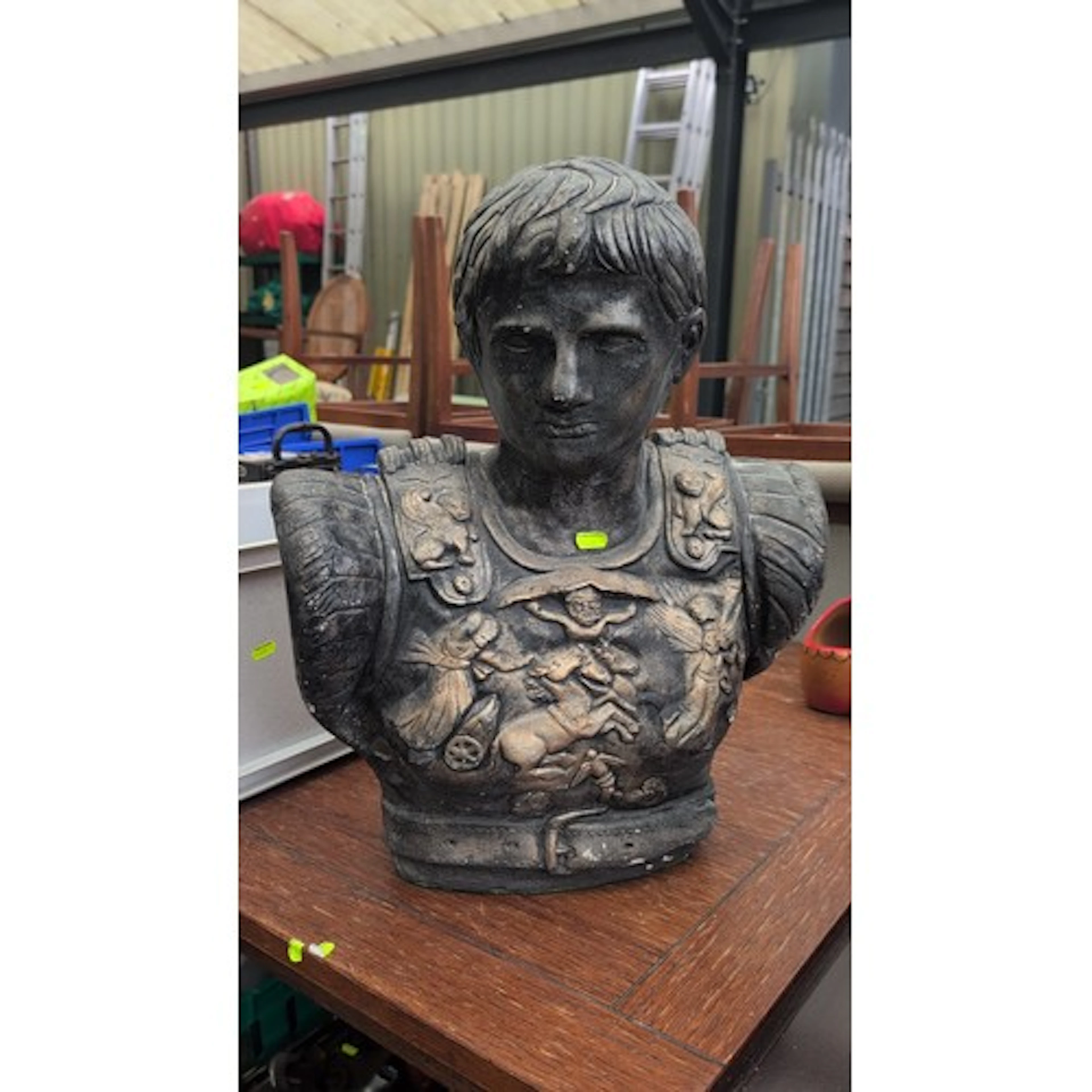 Composite stone garden bust of a Roman soldier, with stylise...
