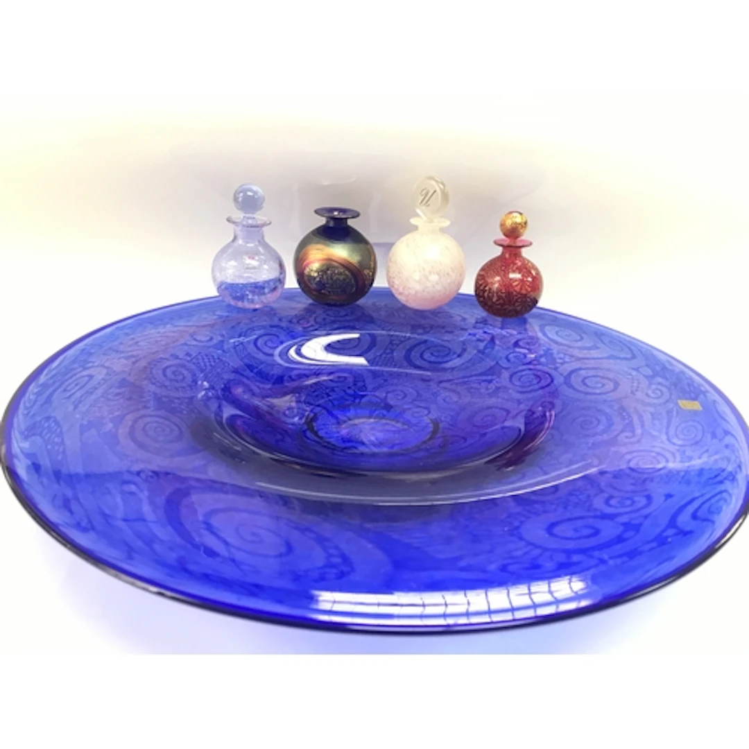 Isle of white glass dish and three valuable perfume bottles