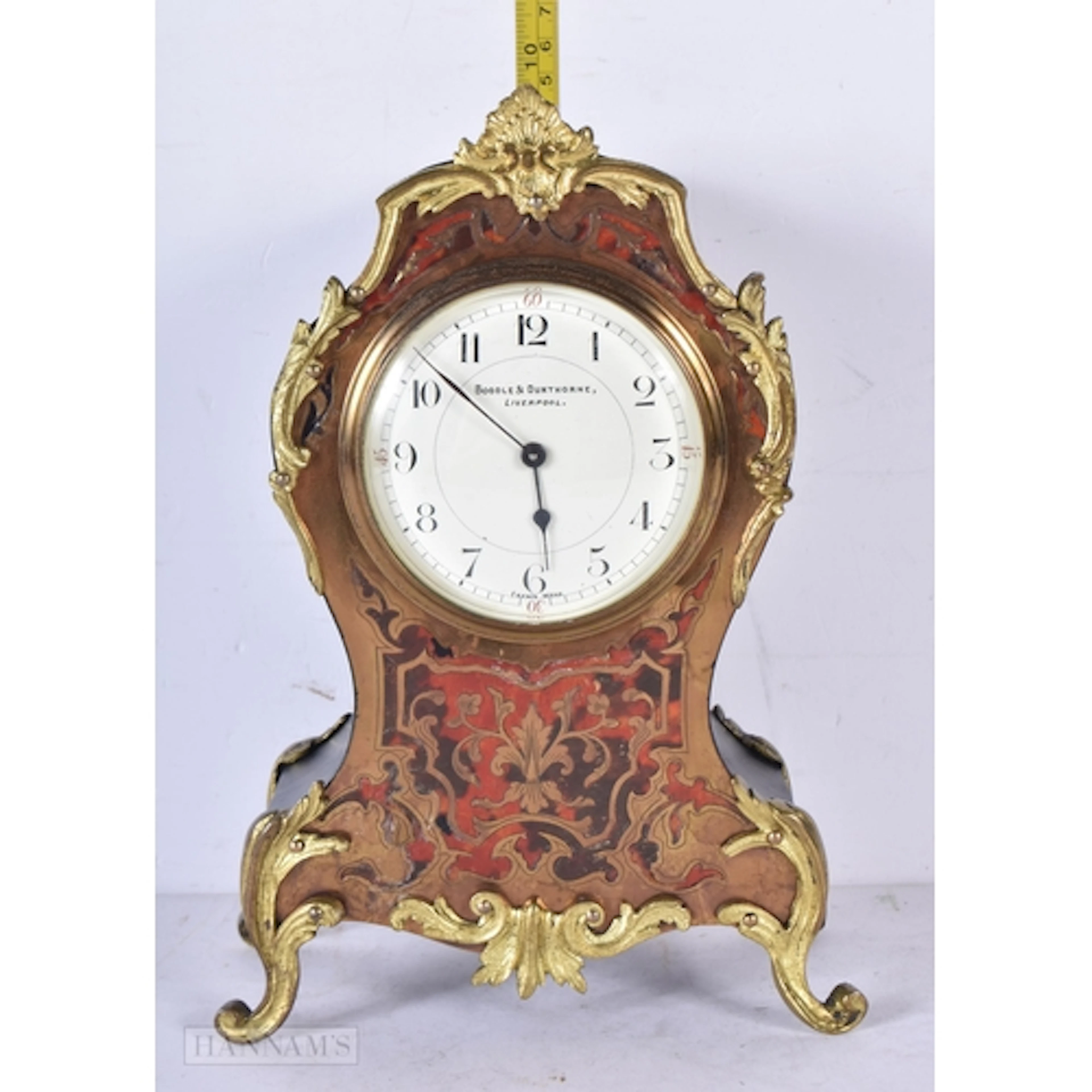 A French Boulle mantel clock with gilt metal decoration and ...