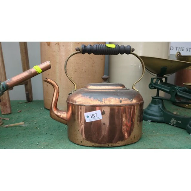 Copper kettle with turned ebonised grip.