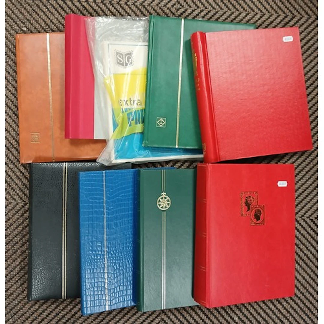 Collection of empty stamp and first day cover albums.