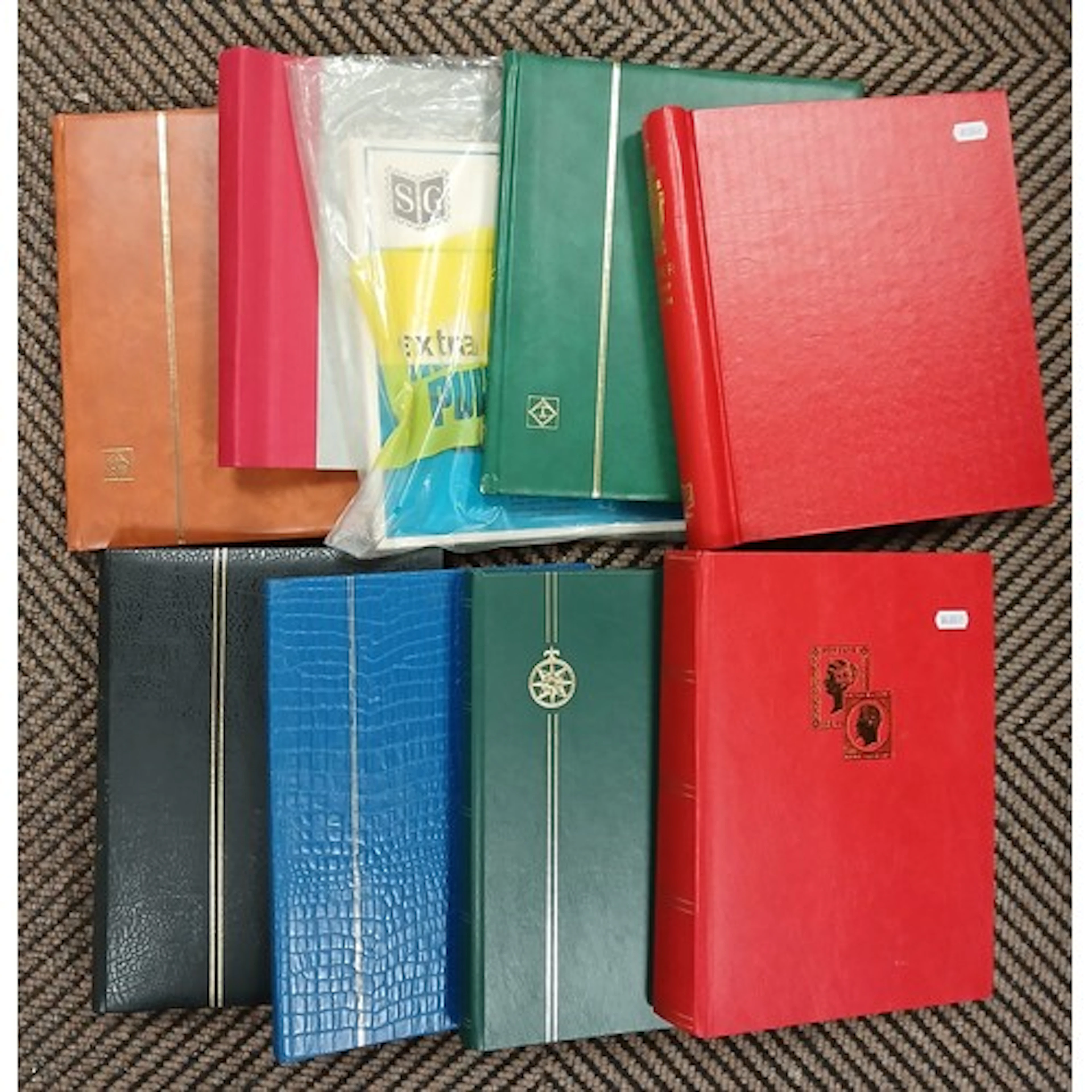 Collection of empty stamp and first day cover albums.