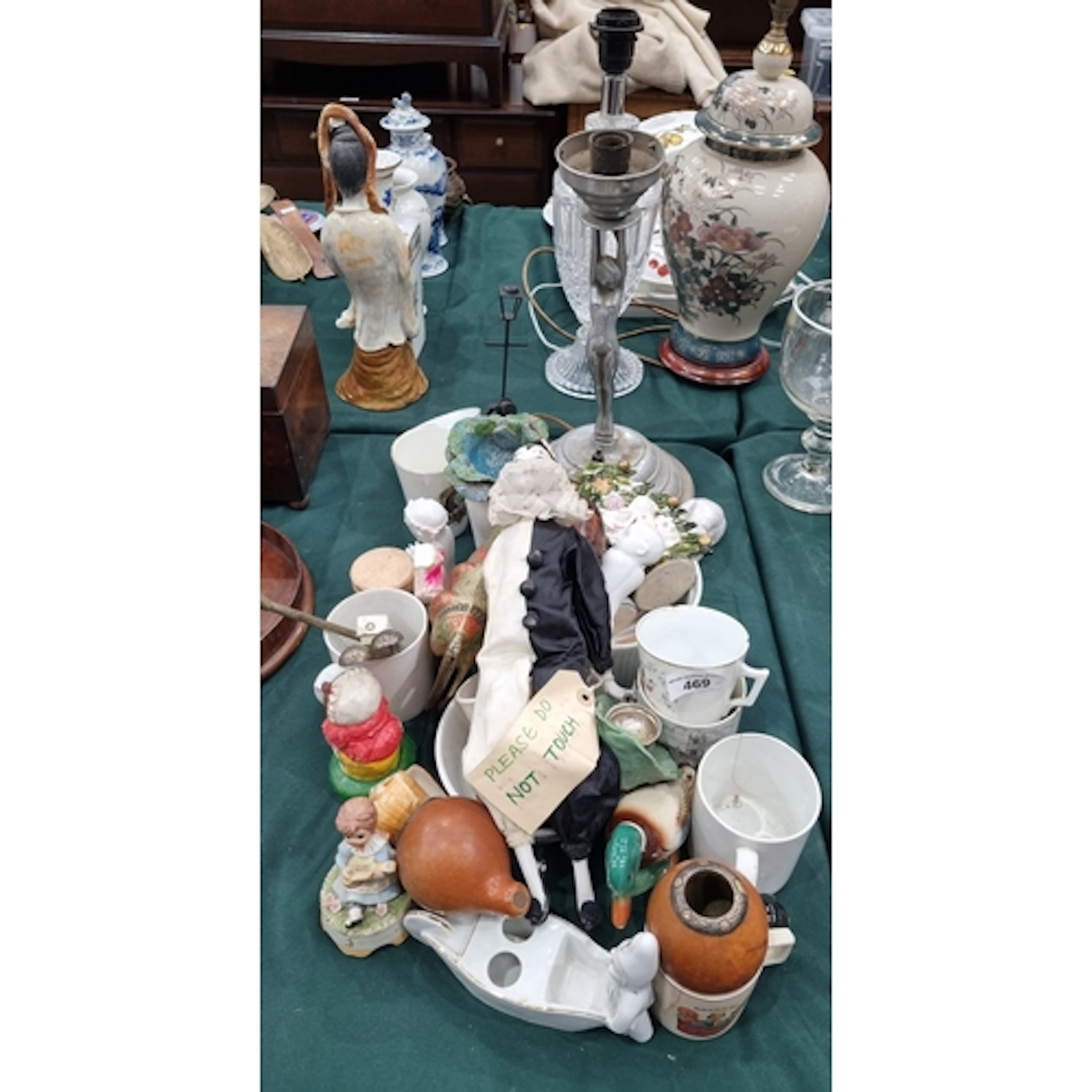 A Pierrot Clown Doll with porcelain head, a figural Table La...