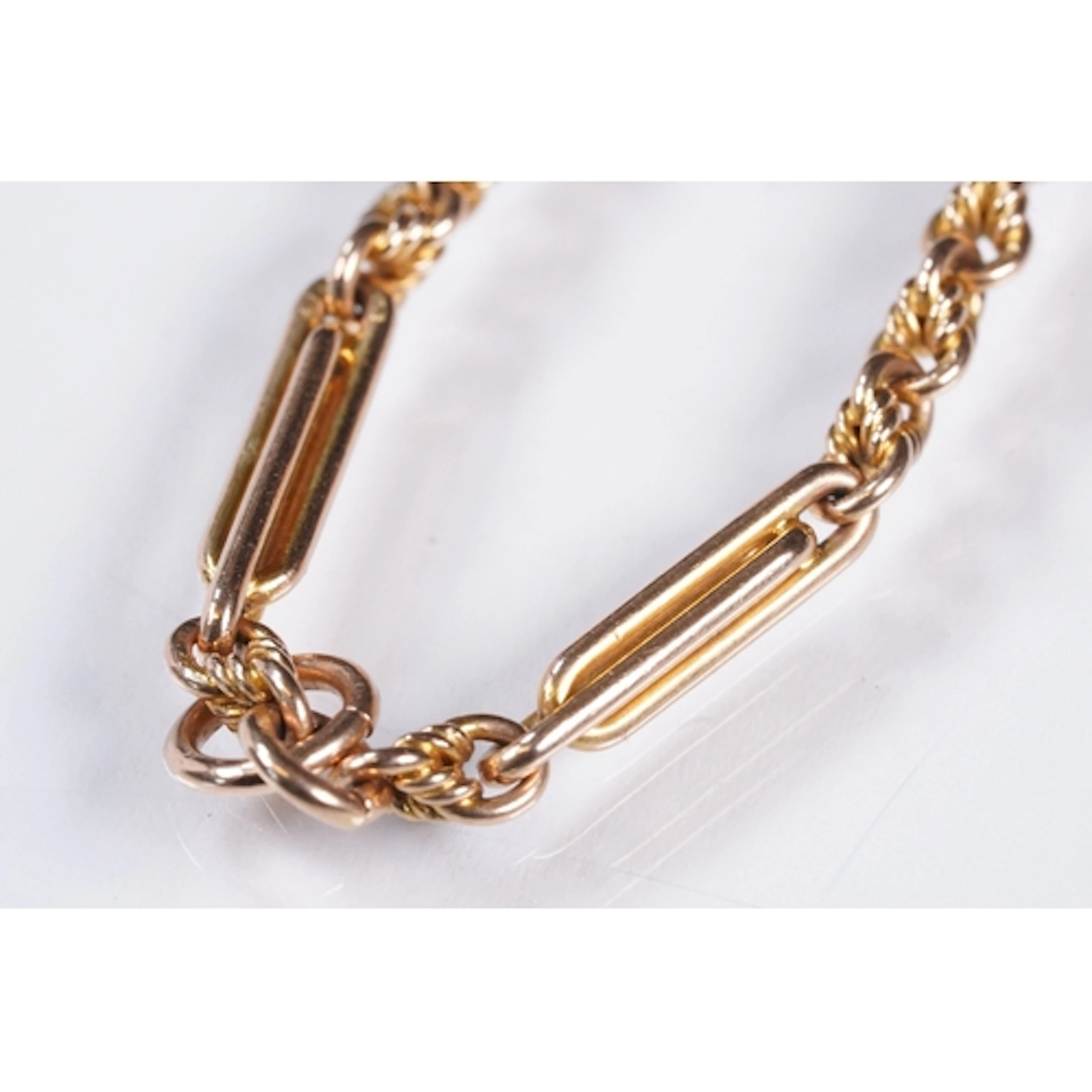 15ct gold trombone link bracelet having two chains united by...