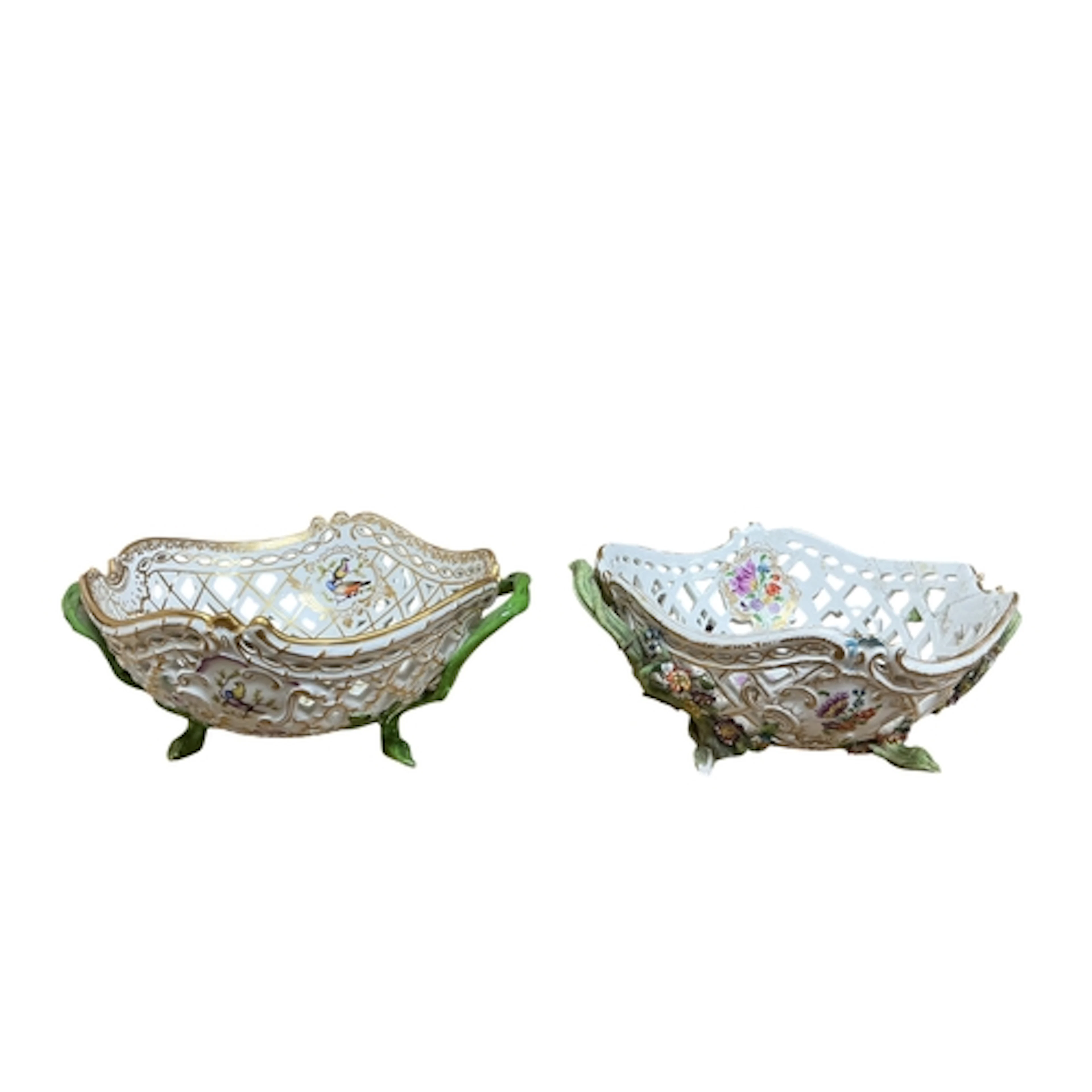 Two Meissen reticulated porcelain baskets painted with exoti...