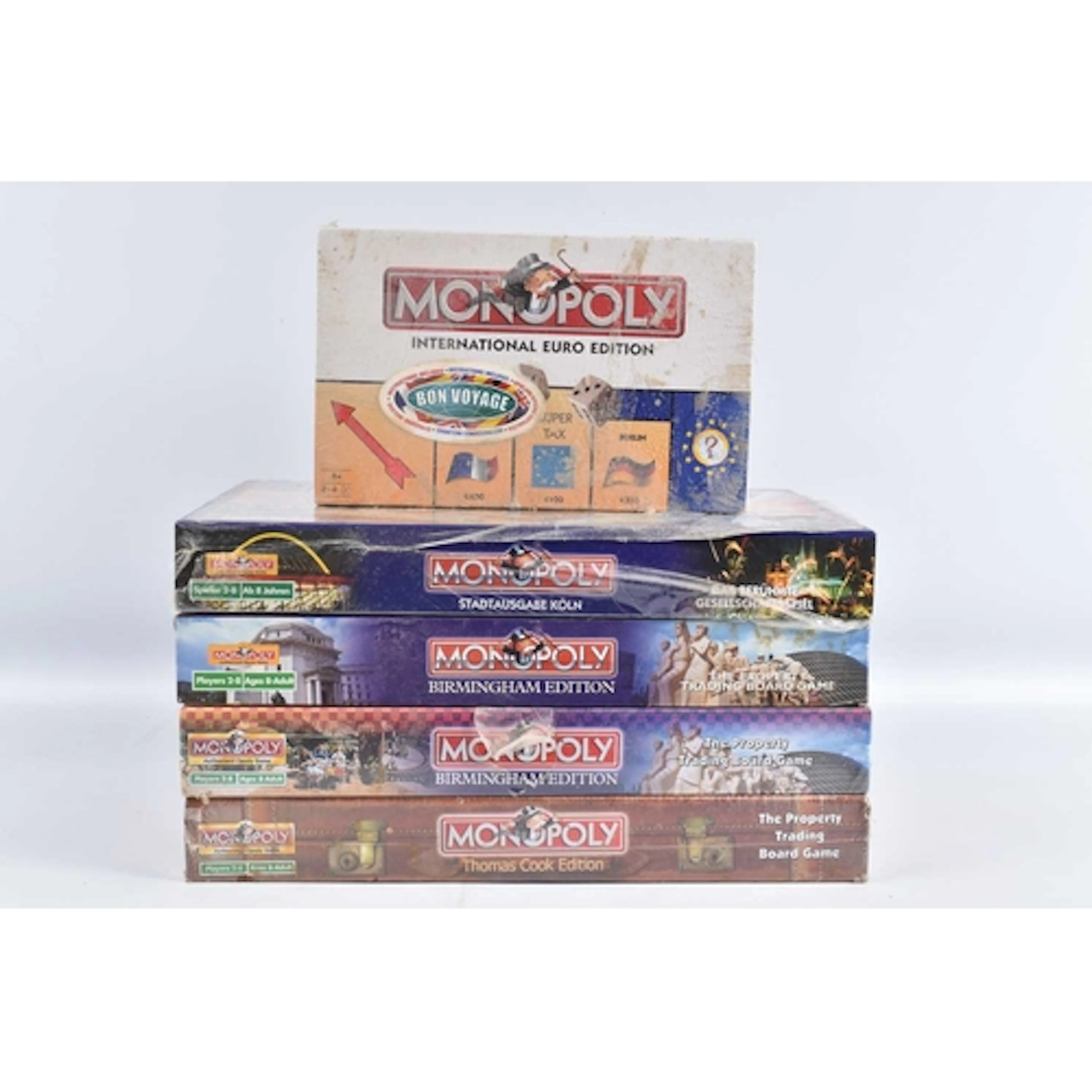 FIVE TRAVEL RELATED MONOPOLY BOARD GAMES, to include a Hasbr...