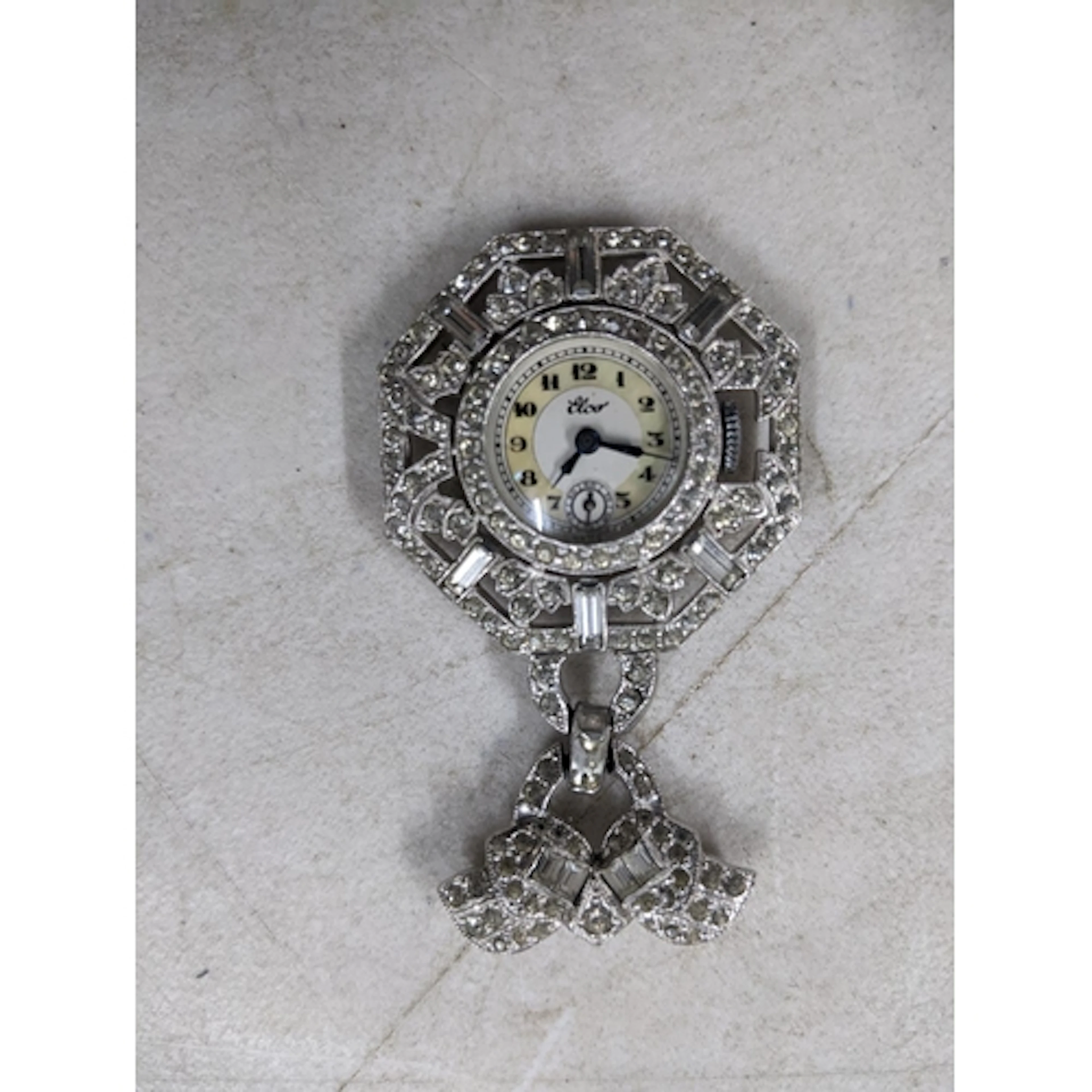 A vintage Elco diamante and paste brooch watch, the watch su...