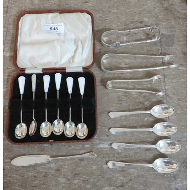 Various silver coffee spoons and tongs, together with a silv...