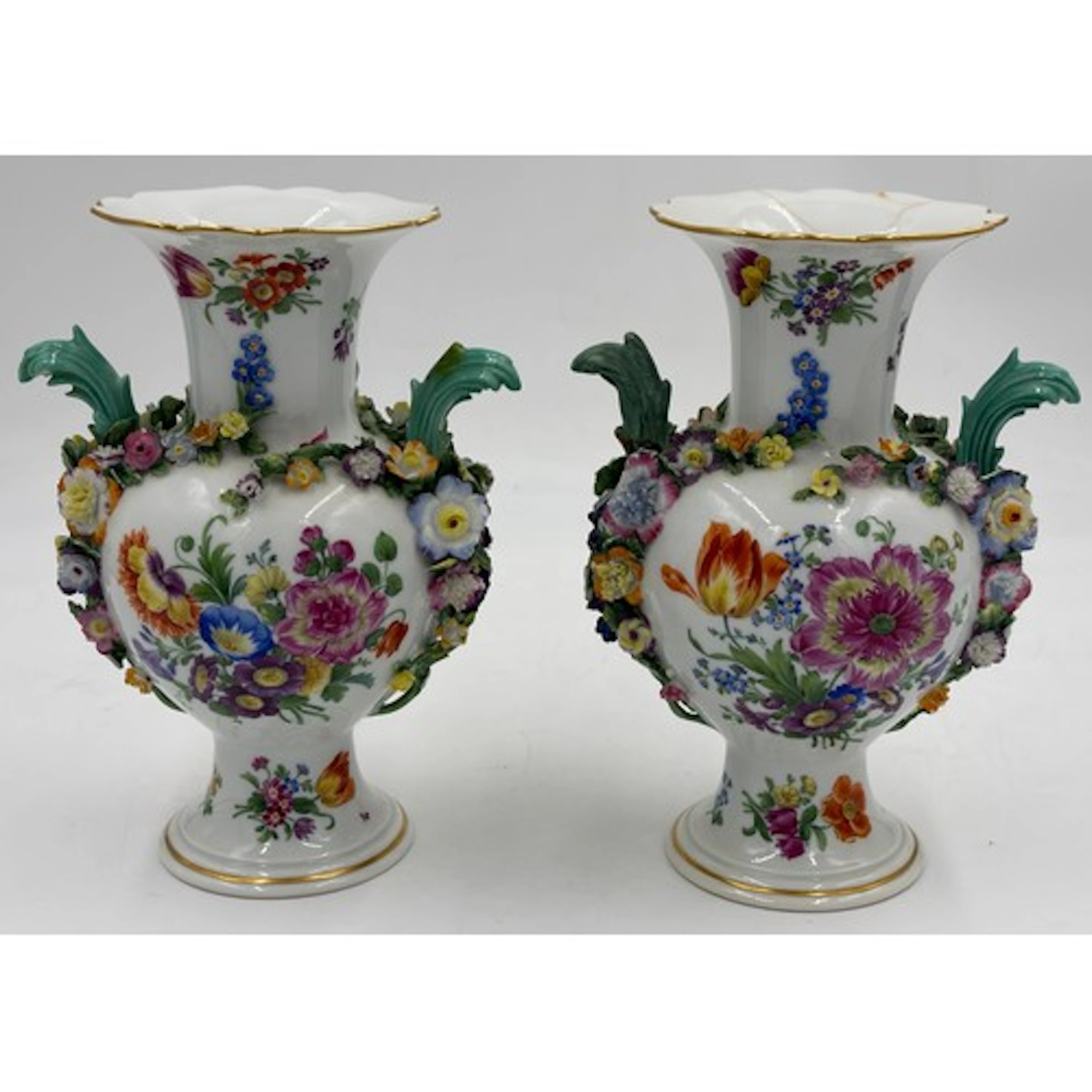 A pair of Meissen twin handled vases with encrusted flowers ...