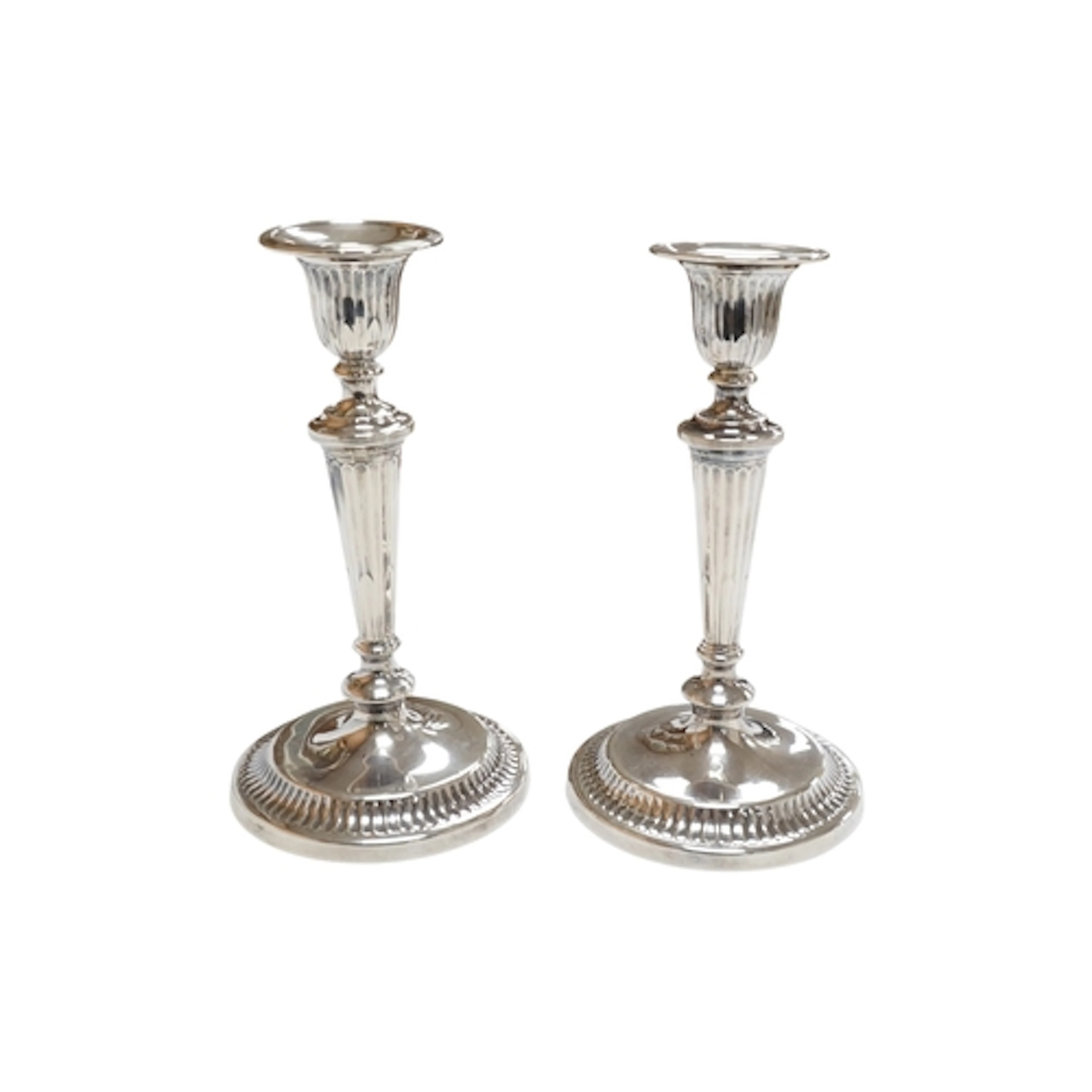 A pair of George V silver mounted candlesticks, with waisted...