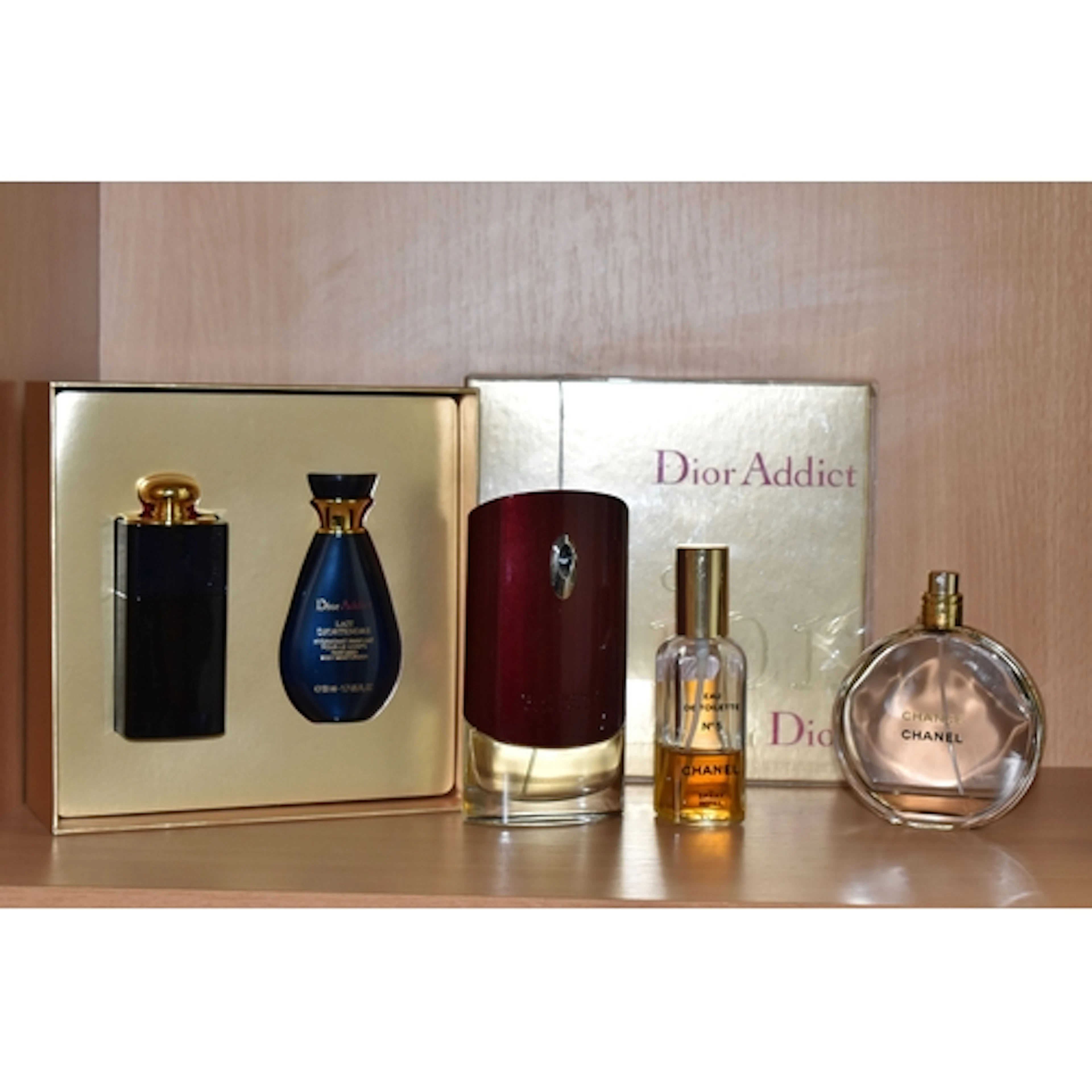FOUR ITEMS OF WOMEN FRAGRANCE, partially used or opened and ...