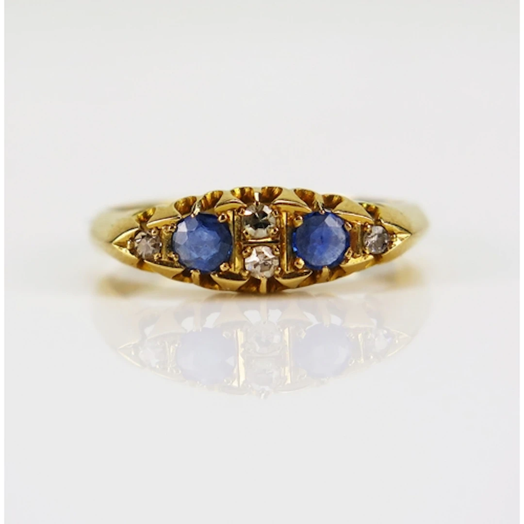 An antique sapphire and old cut diamond ring in an 18ct yell...