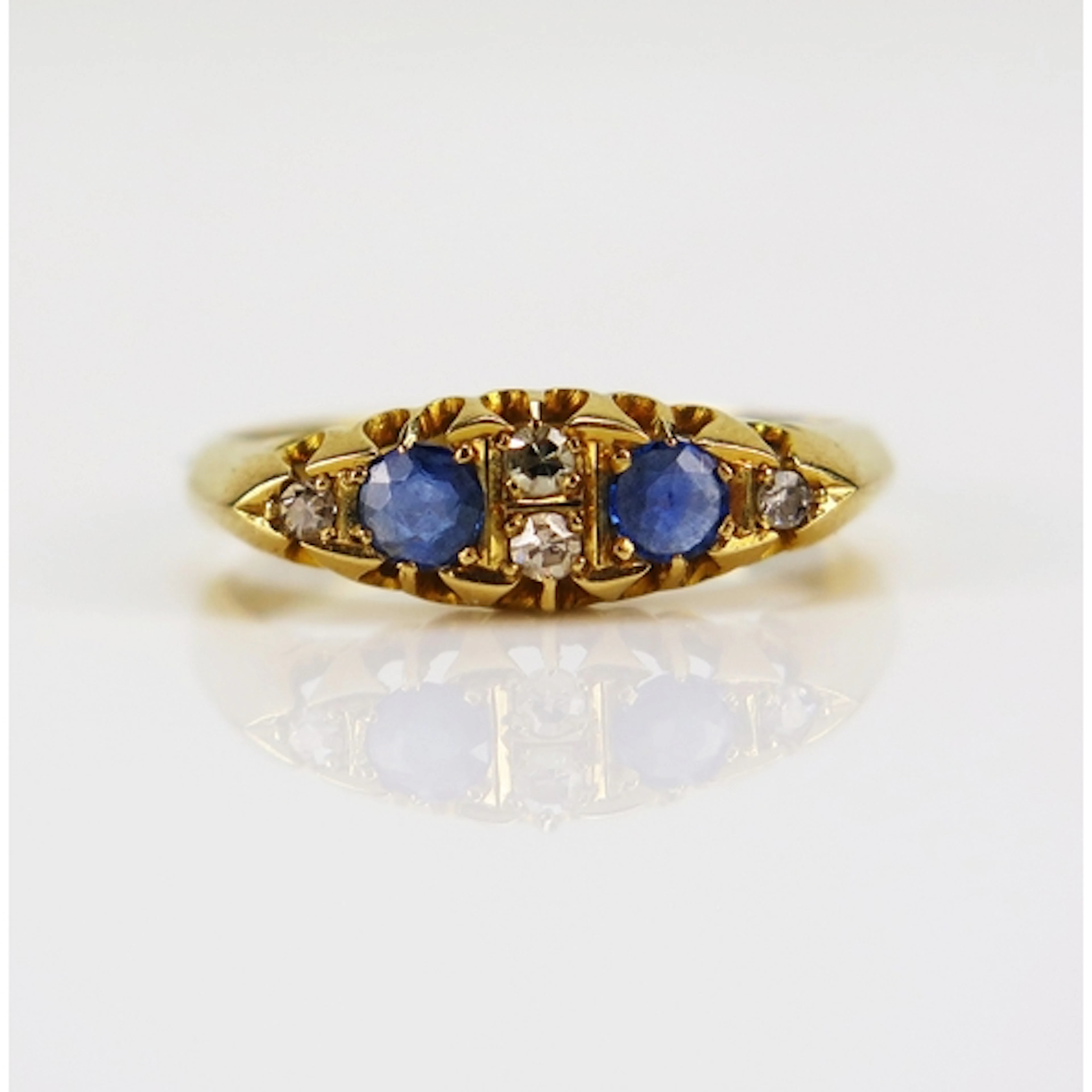 An antique sapphire and old cut diamond ring in an 18ct yell...